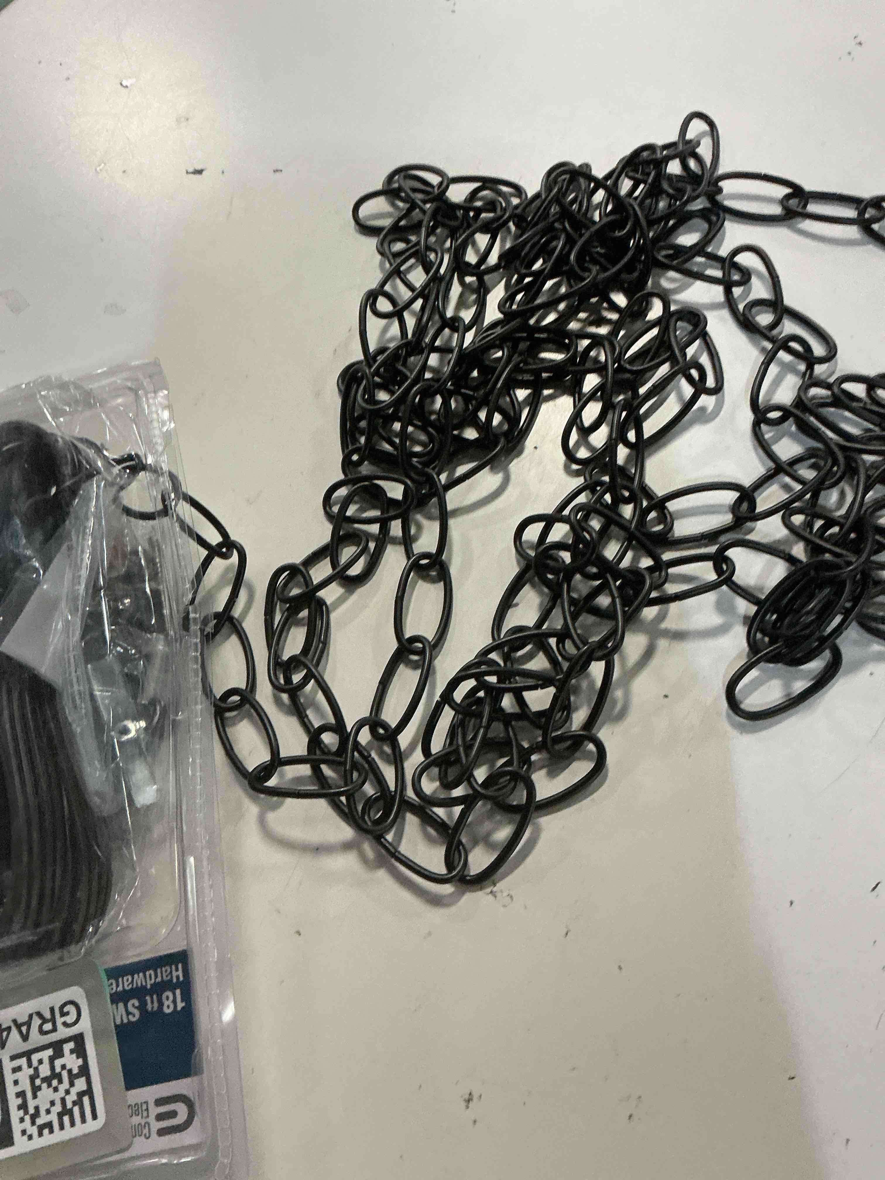 Condition photo showing As Is for commercial electric 18 ft. oil rubbed bronze swag light kit
