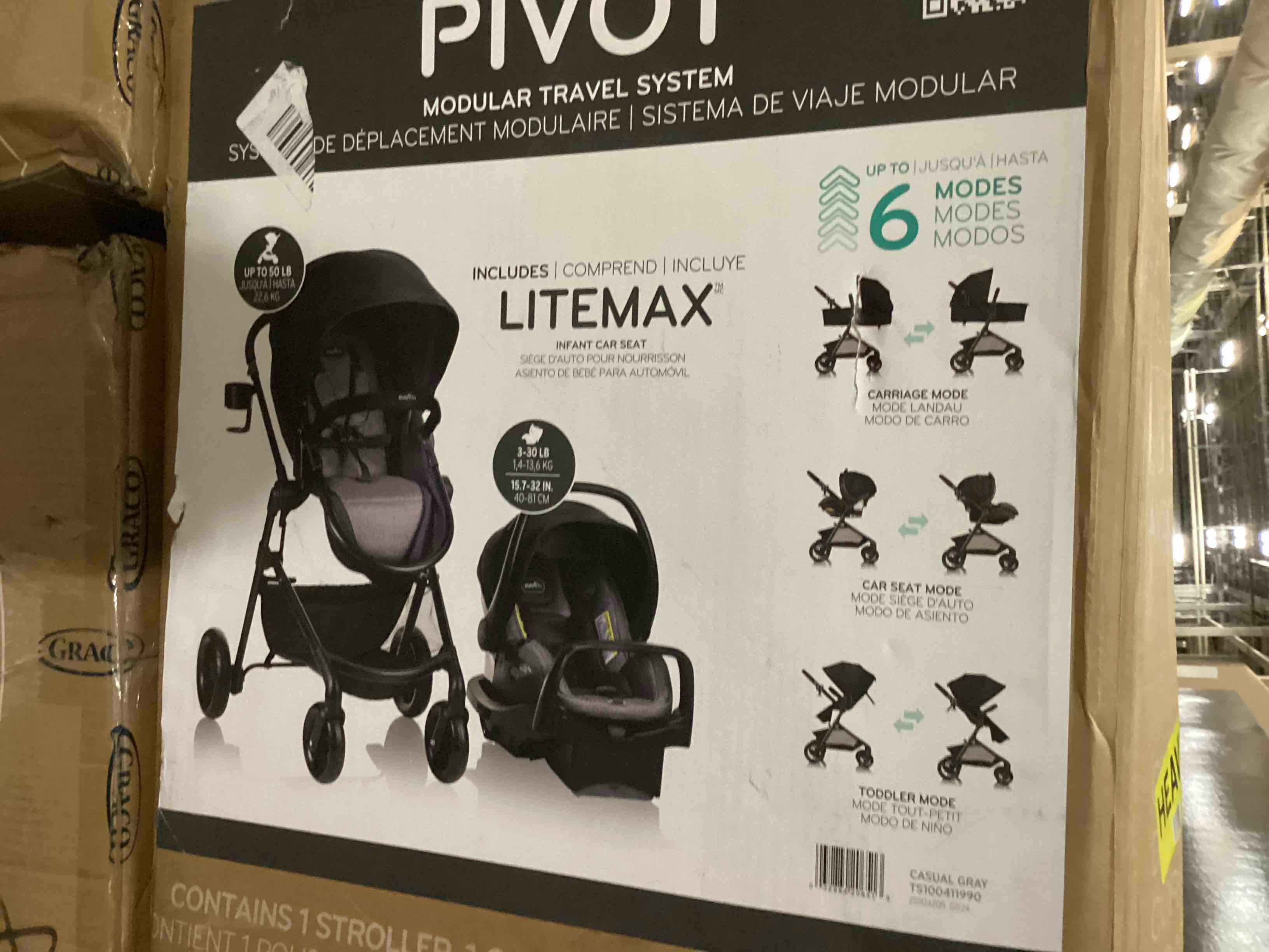 Condition photo showing New/Like New for evenflo pivot modular travel system with litemax infant car seat with anti-rebound bar - casual gray