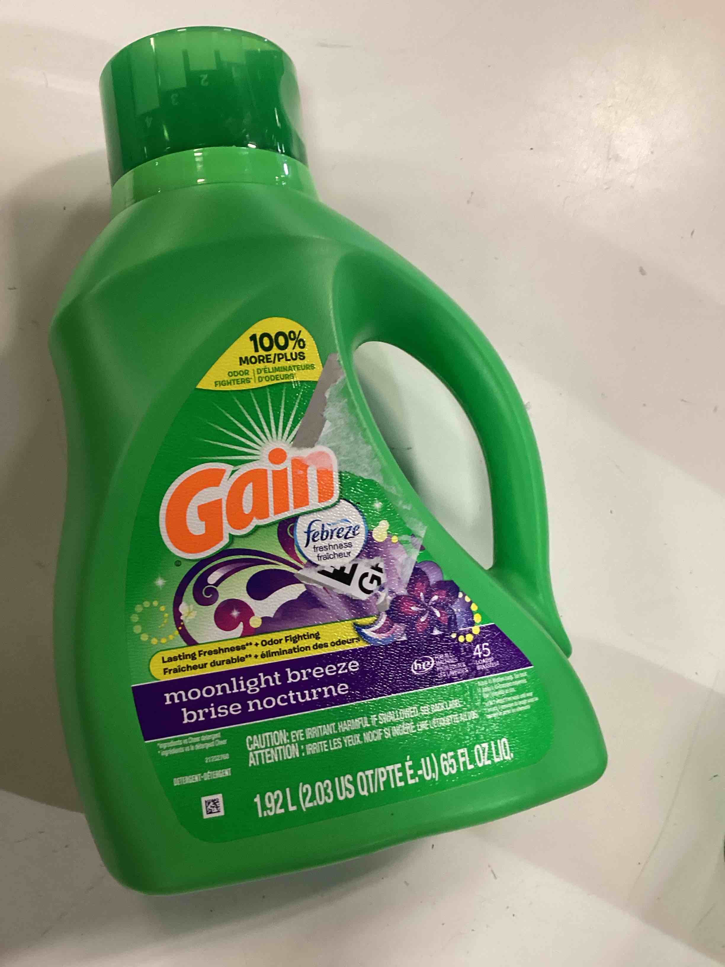 Condition photo showing New/Like New for gain, laundry detergent moonlight breeze + aroma boost, 65 fl oz