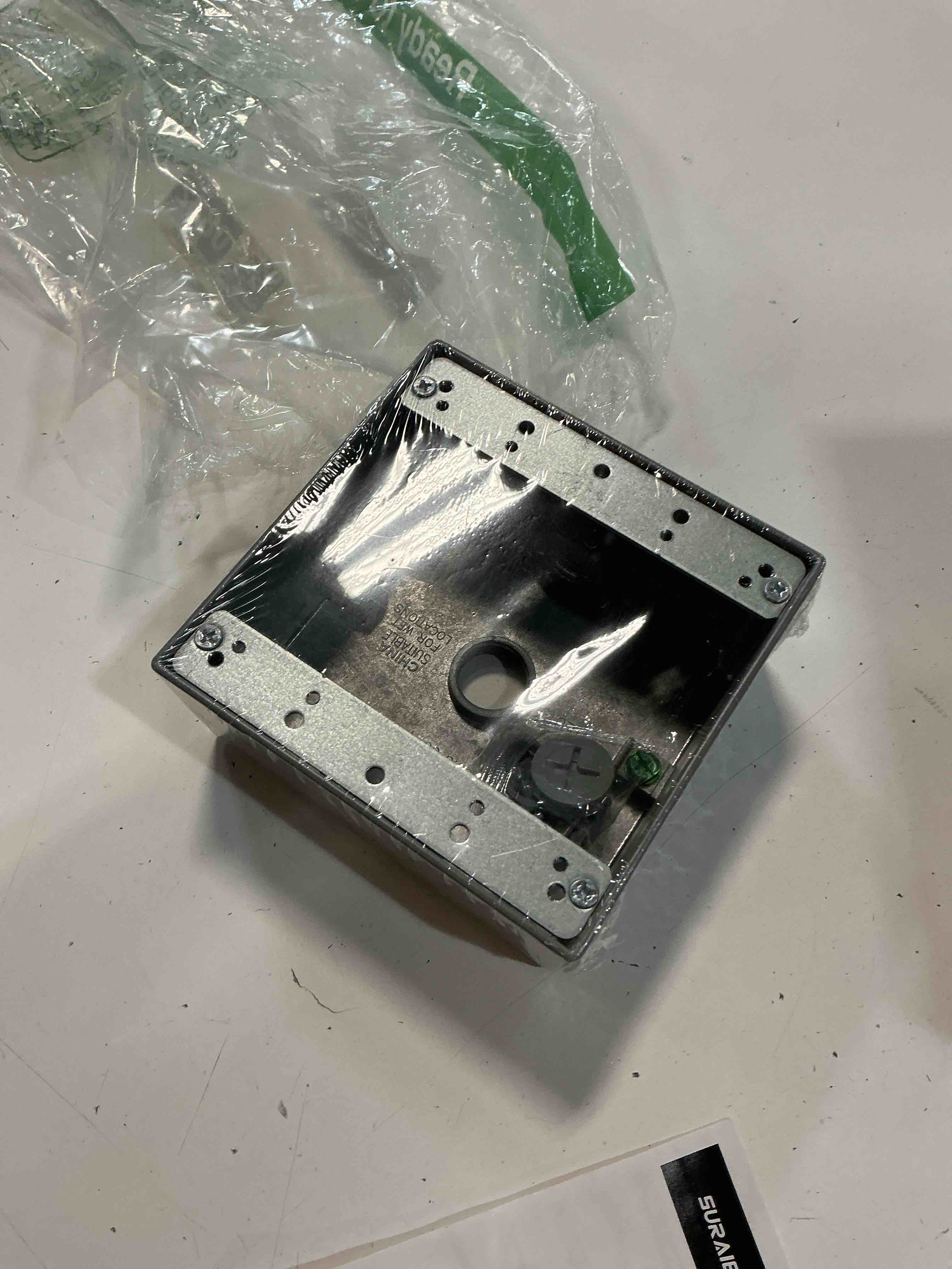 Condition photo showing Good Condition for 2-gang metallic weatherproof outlet box with (3) 1/2 in. holes, gray