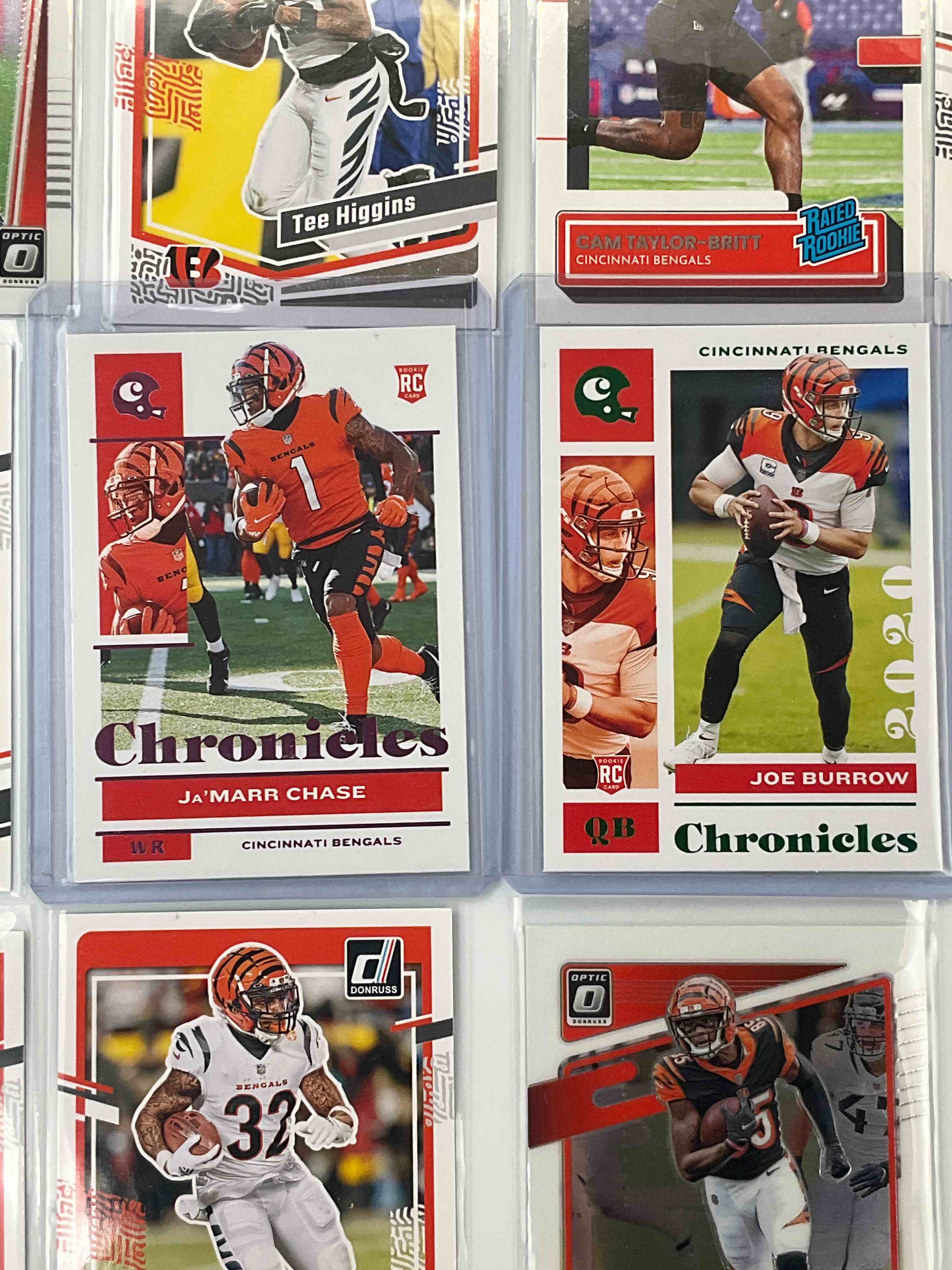 Who Dey! Burrow & Chase Rookies! Bengals 16 Card Football Sports Card Lot, Chronicles & Donruss Base & Optic! Many High-End, Hard To Collect Bengals Cards! Set Includes Joe Burrow 2020 Chronicles Rookie # 19 In Rare Green & Ja'Marr Chase 2021 Chronicles Rookie #17 In Rare Pink. Higgins, Mixon, McPherson, Rare Press Prints & So Much More Included! Calling All Bengals Fans!