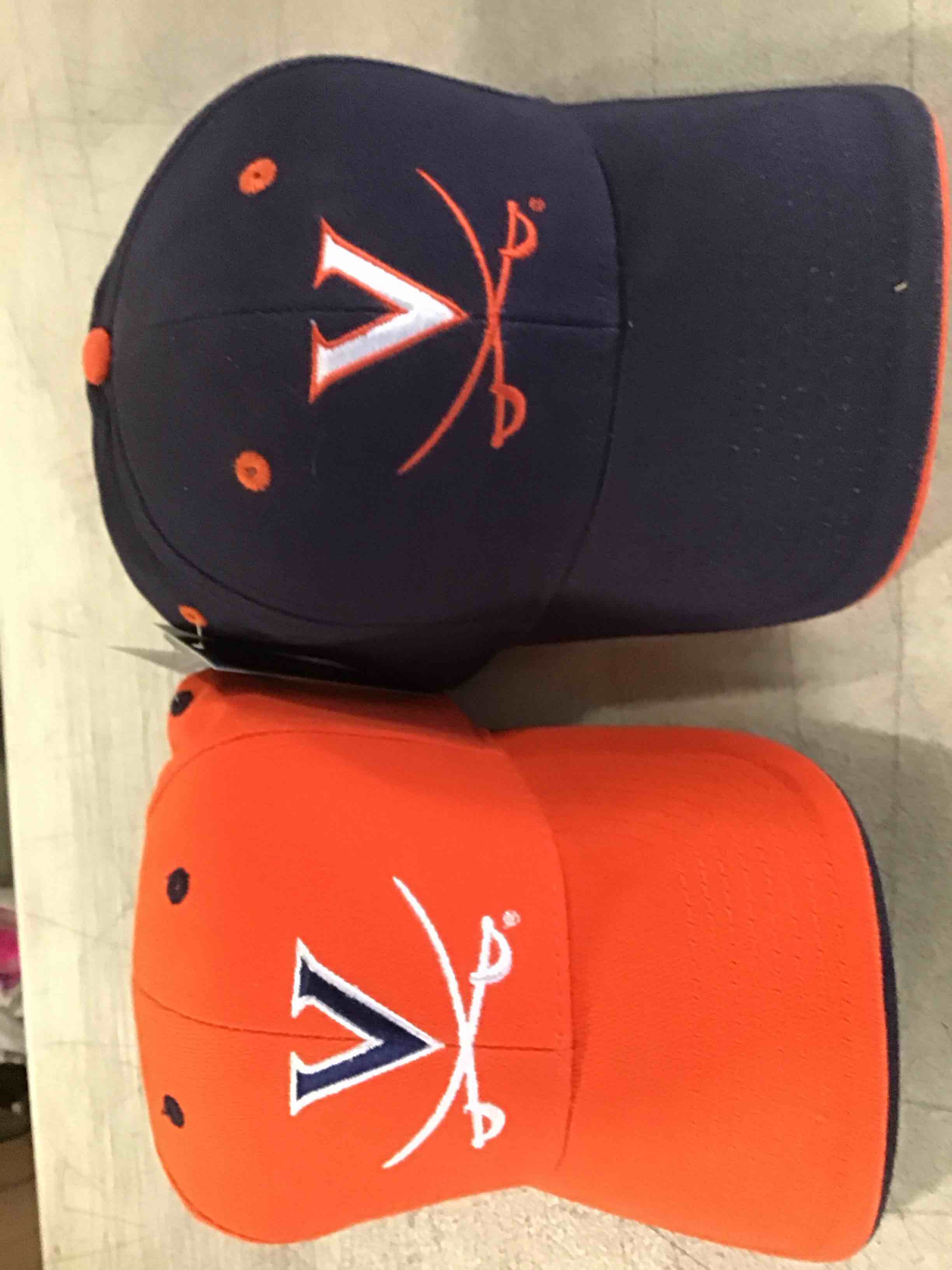 Lot of 144 Baseball Caps Cavaliers half Orange half blue.
