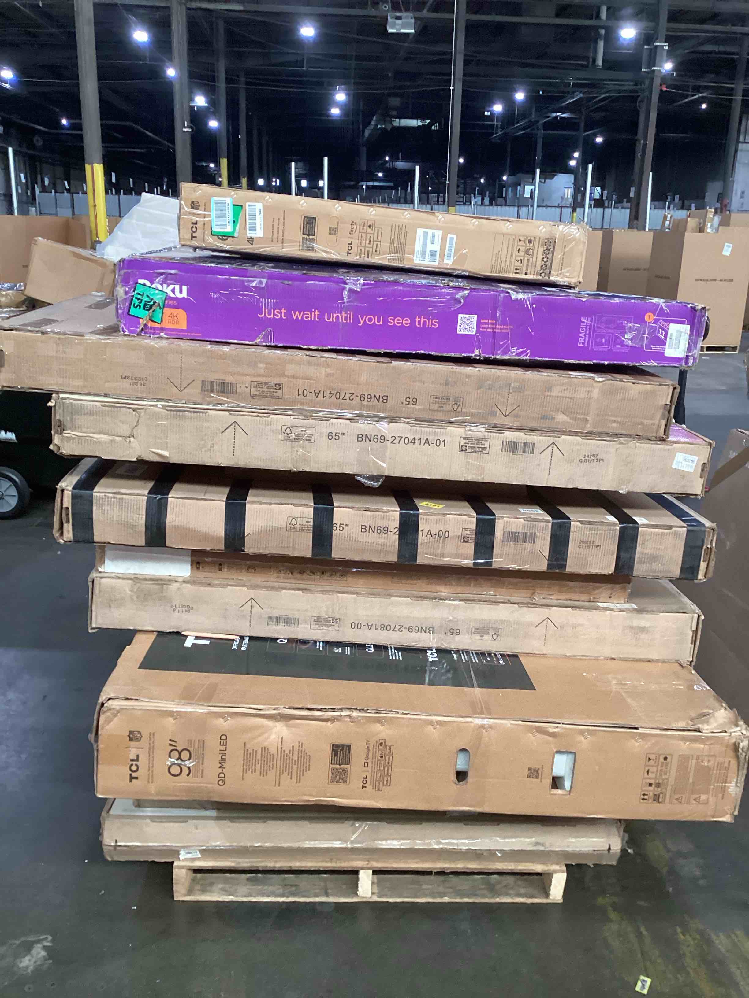 pallet of broken tvs 