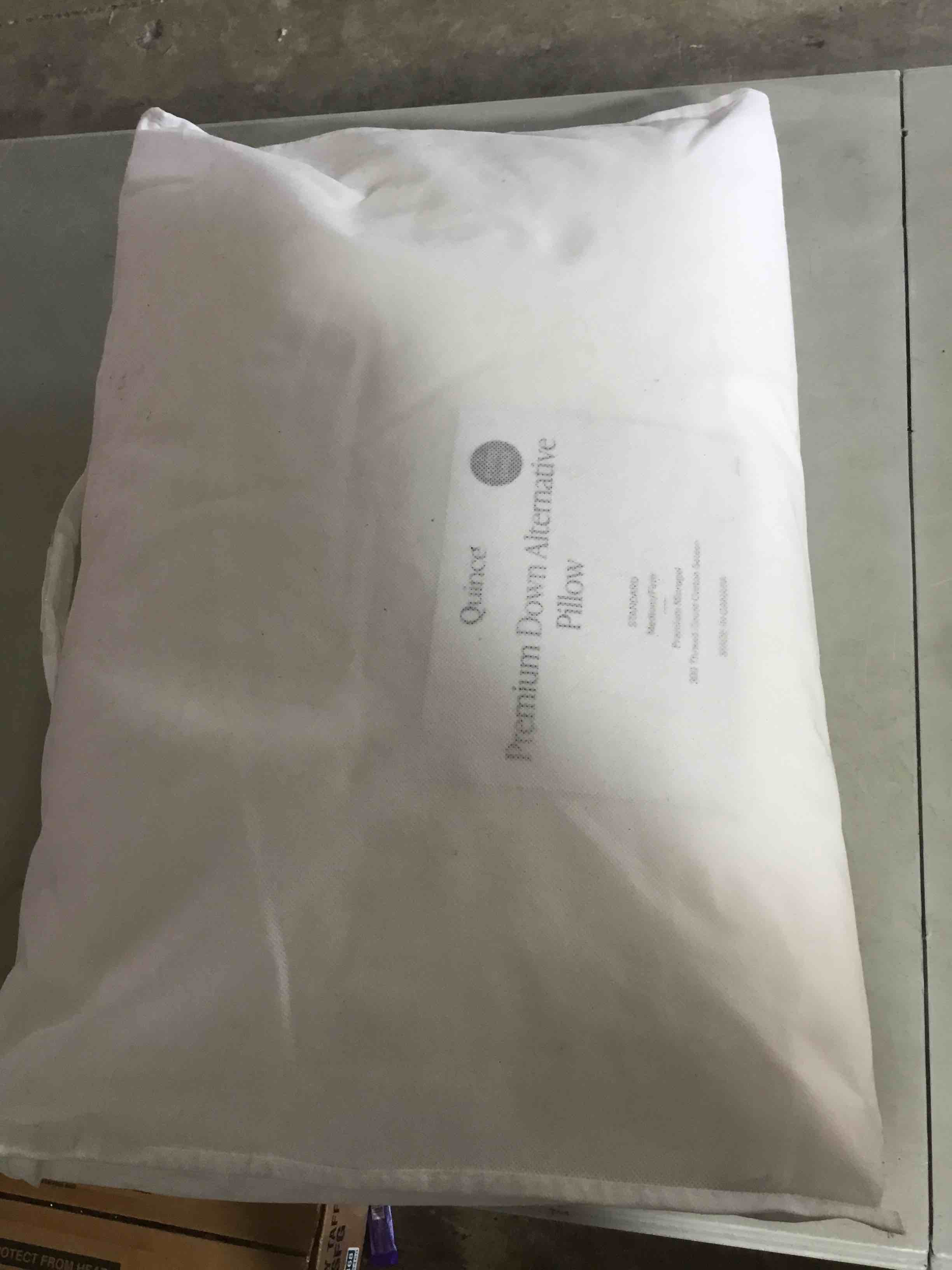 Condition photo showing New/Like New for quince premium down alternative pillow standard size medium/firm