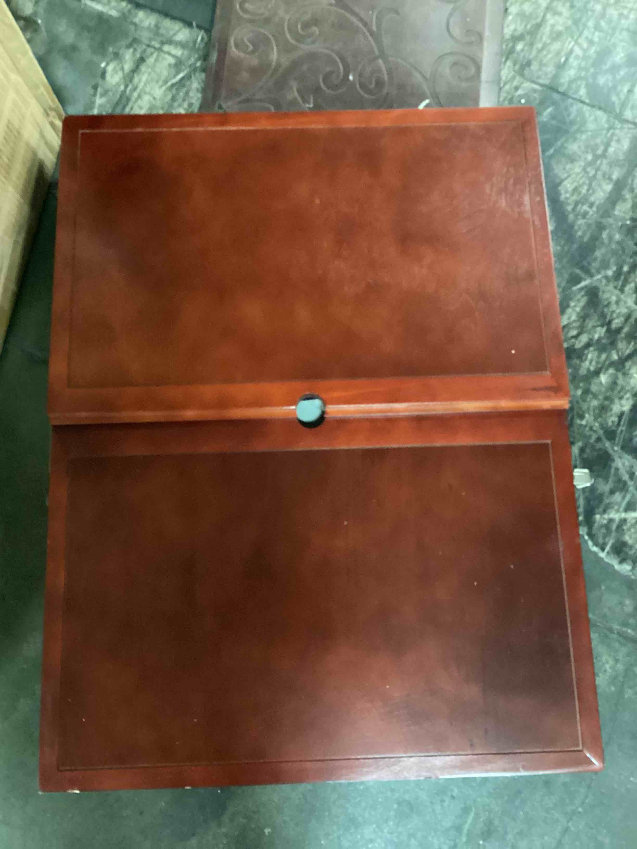 this is the solid wood puzzle table that sets up quickly and easily folds for compact storage. The hinged tabletop unfolds to create a 30" x 22" center work area for puzzles up to 27" x 19", flanked by a 23" x 14" panel on each side for sorting pieces. Its top also tilts to one of three heights (11 1/8", 14 1/4", and 16 1/2") to make for comfortable puzzling on an angle while sitting in a chair. Its surface is lined with gray felt that prevents pieces from sliding. Three inserts keep a puzzle intact while folding for storage. Espresso finish. Folded 33" x 25" D x 33 /4" H, open 66" L x 25" D x 30 1/4" H. (36 lbs.)