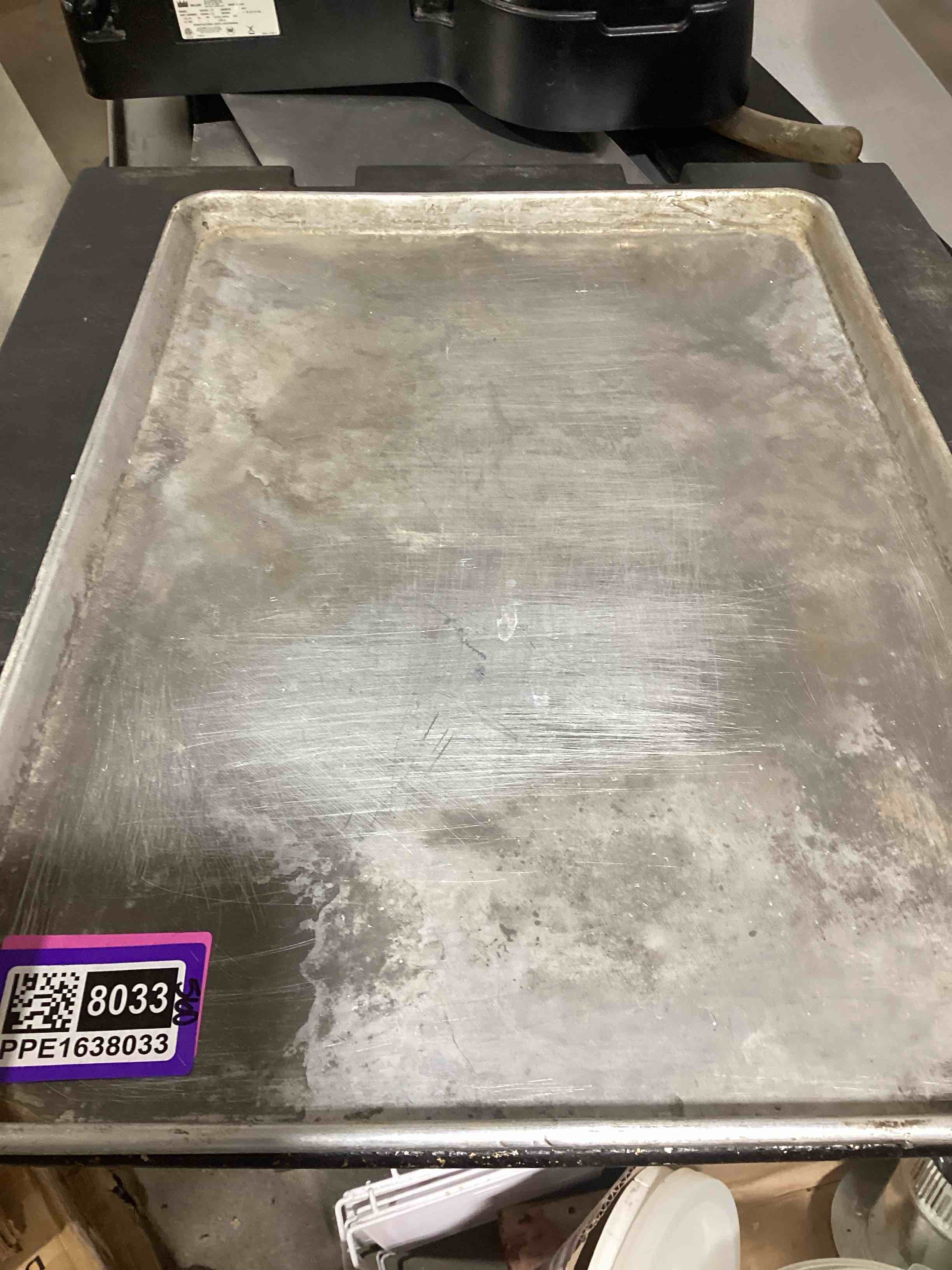Condition photo showing As Is for lot of 2- assorted pizza pans your bid per pan 