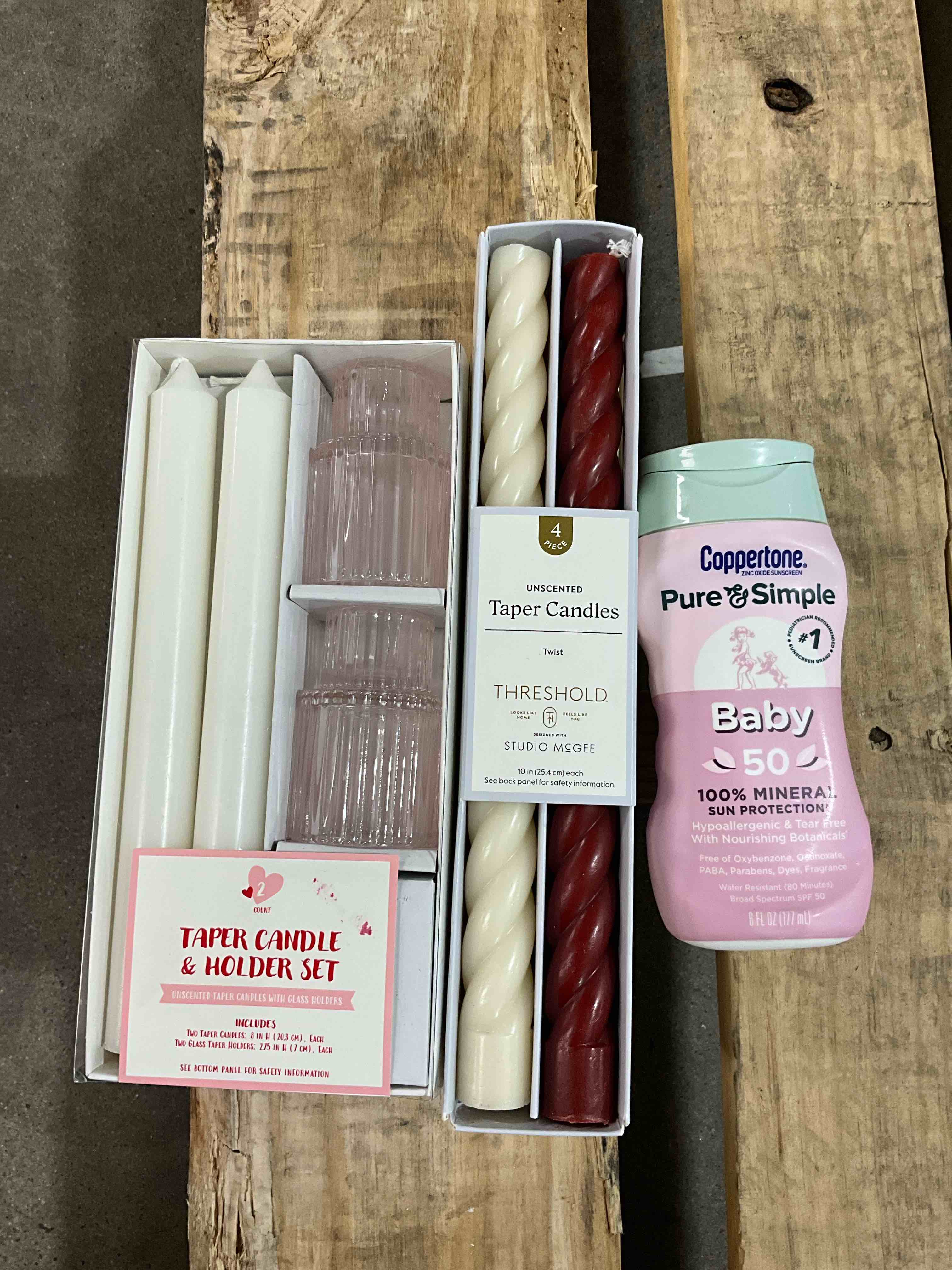 Assorted items candles with holder, taper candles and Coppertone Pure & Simple Baby 100% Mineral Sunscreen Lotion Infant SPF 50 6 fl oz