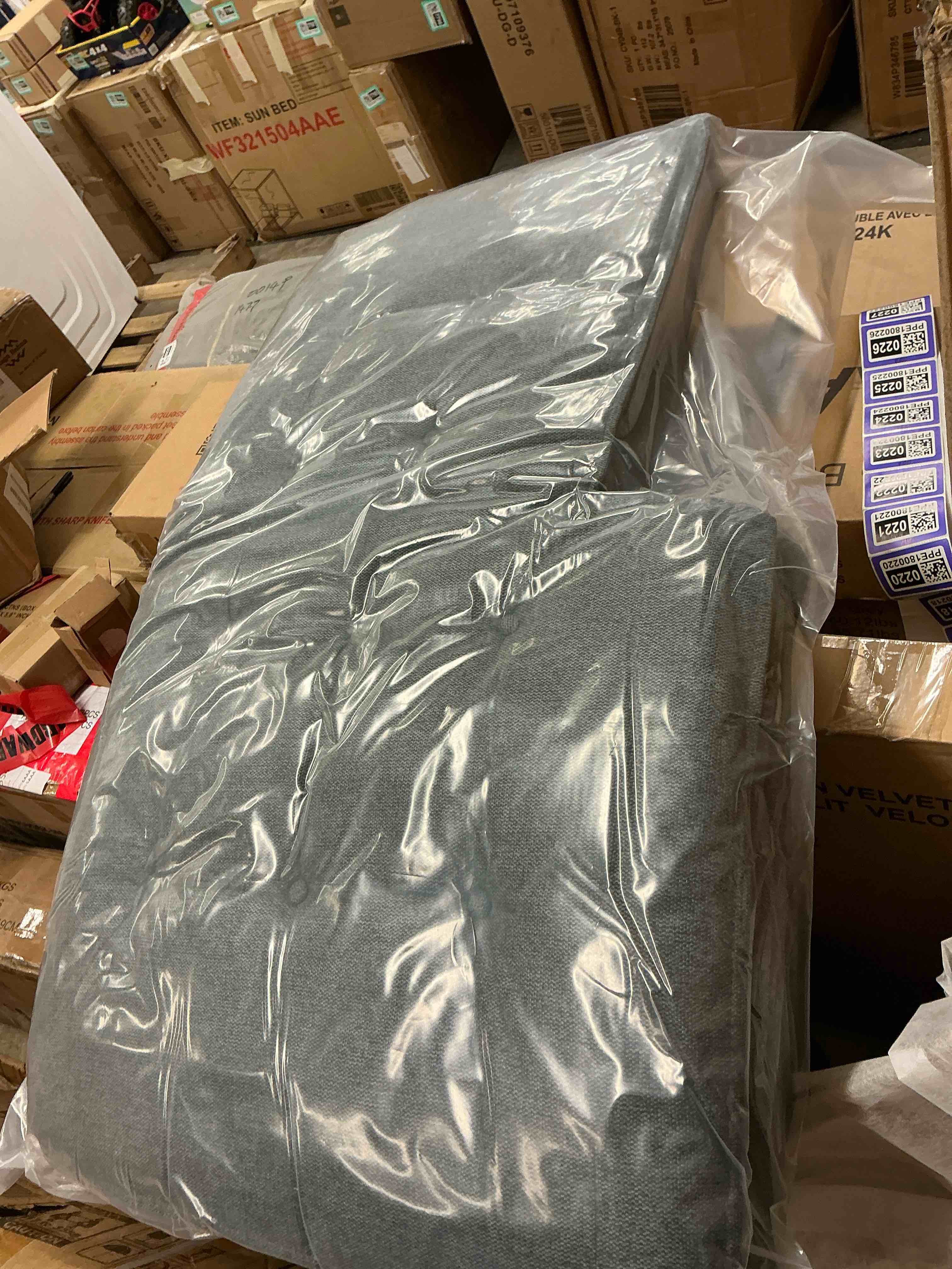 ( incomplete) Part of a gray sofa