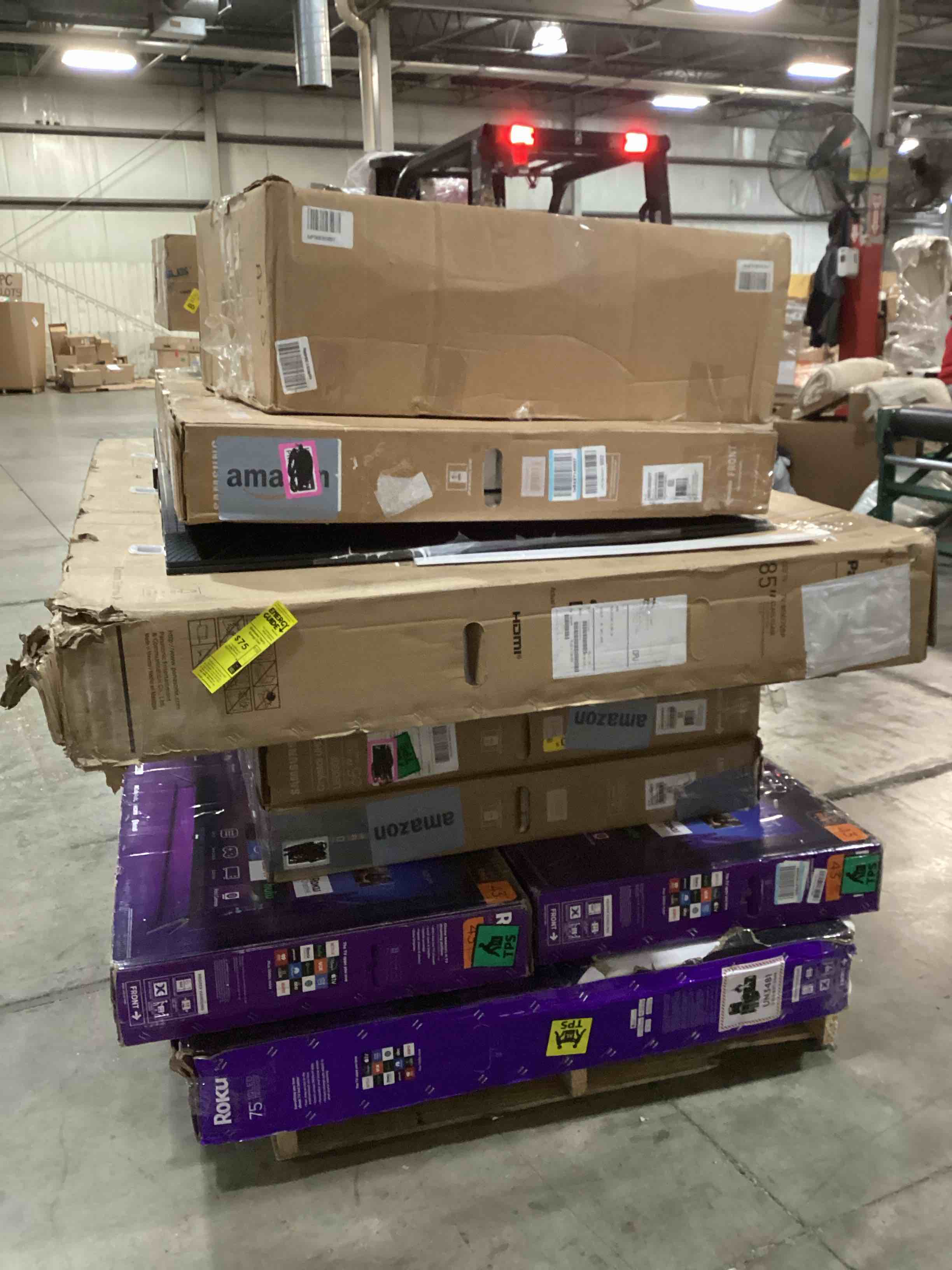 pallet of defective electronics for parts