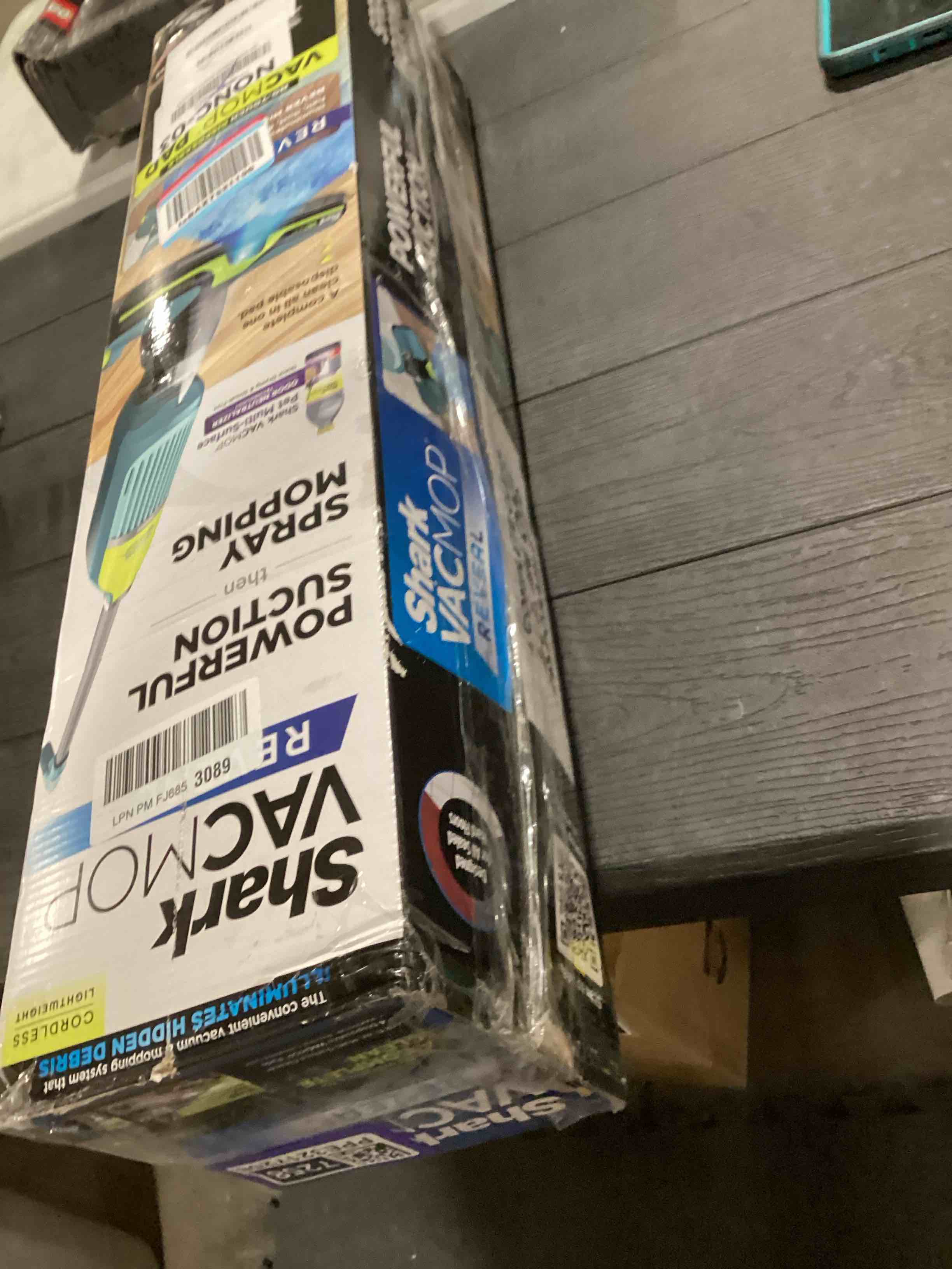 Condition photo showing As Is for Shark VACMOP Reveal New Cordless Hard Floor Cleaner, Vacuum & Spray Mop, Powerful Suction, Lightweight, Illumination Light, Includes 4 Disposable Pads, 12oz Pet Multi-Surface Cleaning Solution, VM401 New Vacmop Reveal With 4 Pads