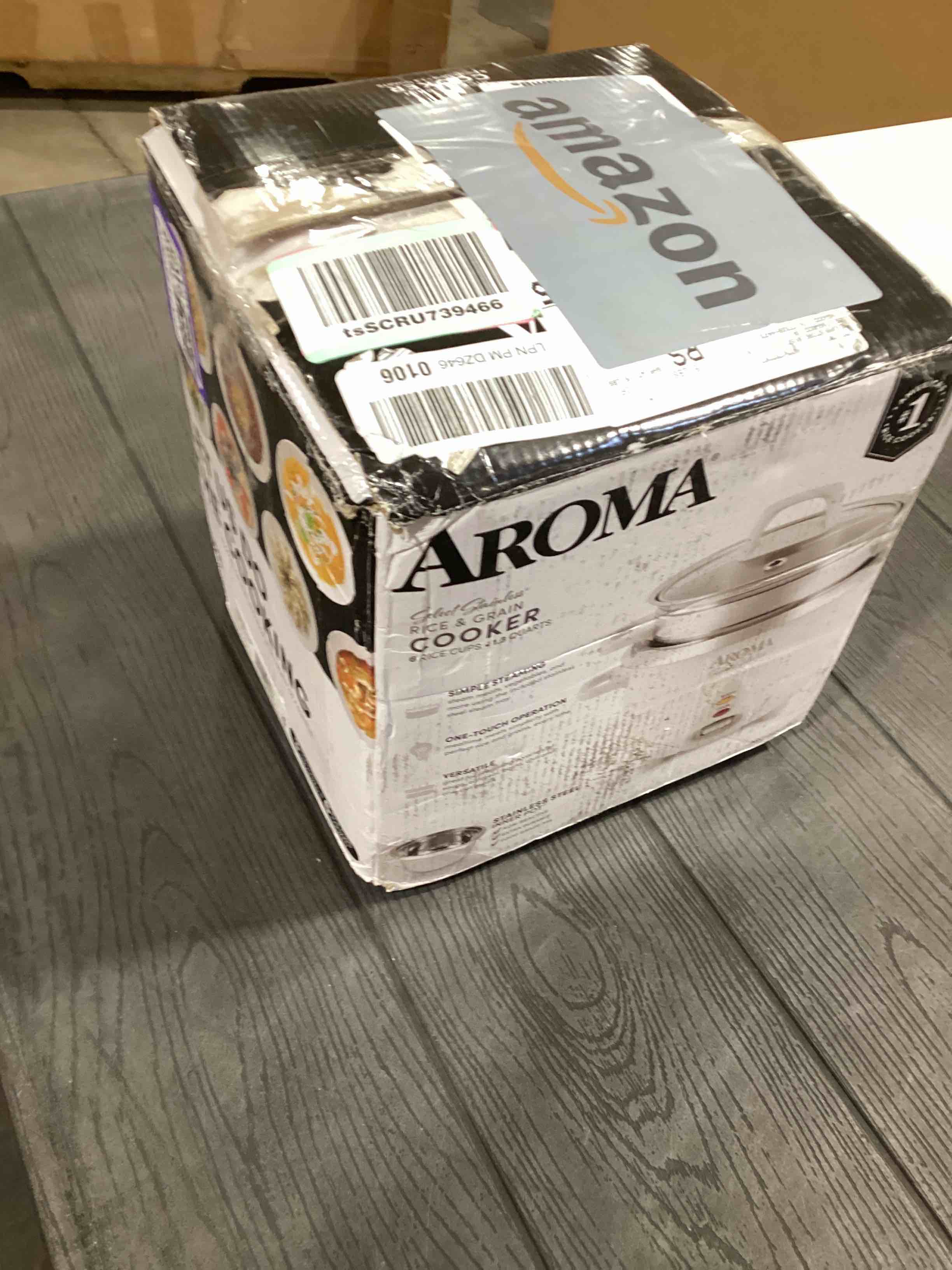 Condition photo showing As Is for Aroma Housewares 6-Cup (Cooked yield ) / 1.2Qt. Select Stainless Pot-Style Rice Cooker, & Food Steamer, One-Touch Operation, White