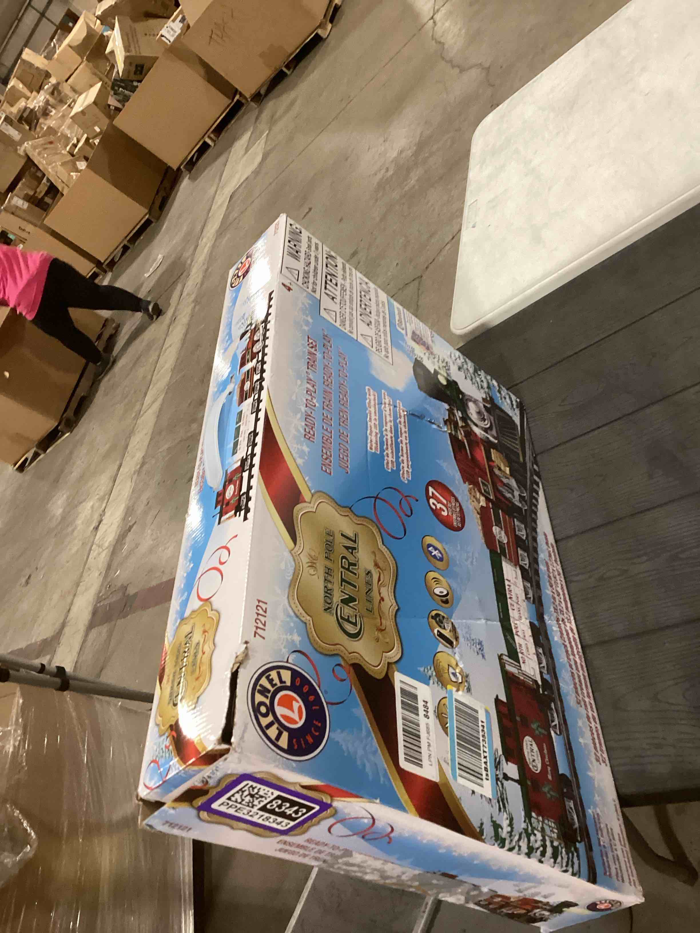 Condition photo showing As Is for Lionel Battery-Operated North Pole Central Freight Toy Train Set with Bluetooth, Locomotive, Train Cars, & Track with Authentic Train Sounds, Lights, & Water Vapor Smoke Effects for Kids 4+