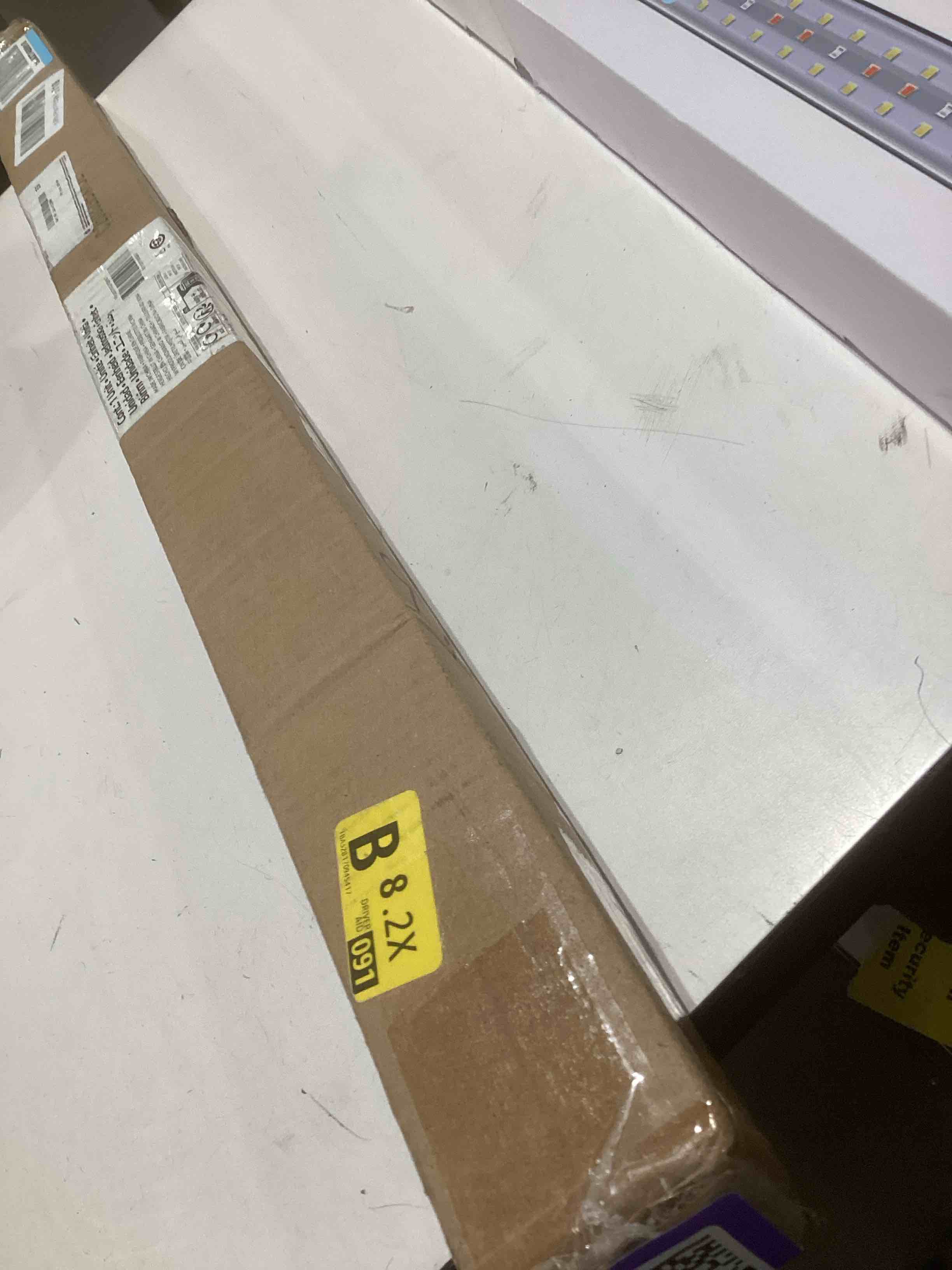 Condition photo showing Good Condition for Amazon Basics Adjustable Sturdy Spring Tension Curtain Rod, No Drilling/No Holes, 36-54", Black, Classic Finial Black 36-54" Indoor