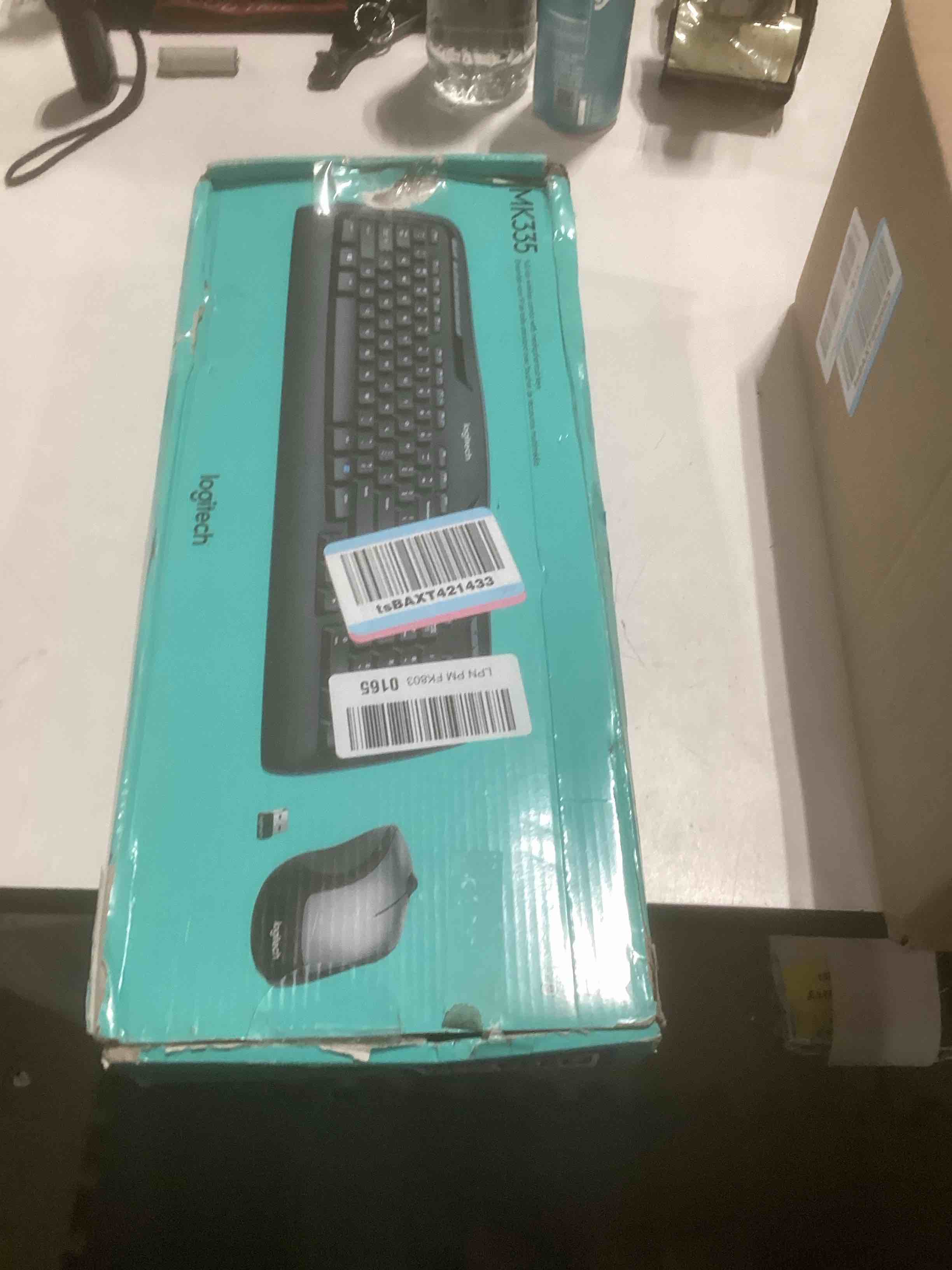 Condition photo showing As Is for Logitech MK335 Quiet Wireless Keyboard and Mouse Combo - Black/Silver Keyboard and Mouse Combo Wireless, Ambidextrous