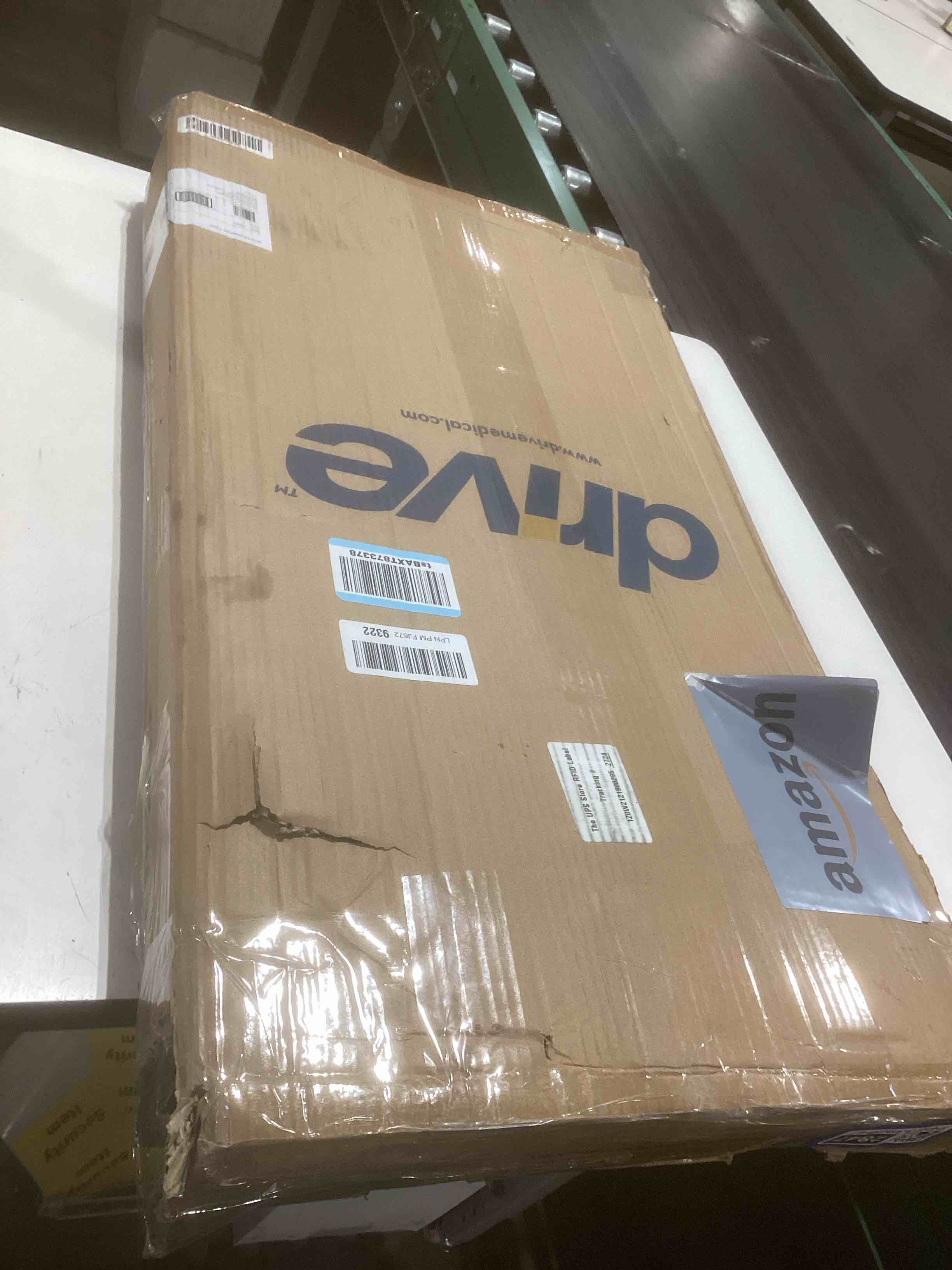 Condition photo showing As Is for Drive Medical Overbed Table with Wheels - Secure Height Adjustment for Comfort - Non Tilt Surface - Smooth Rolling Design - Home & Hospital Use - Woodgrain Laminate Top - Silver Vein Silver Vein Table