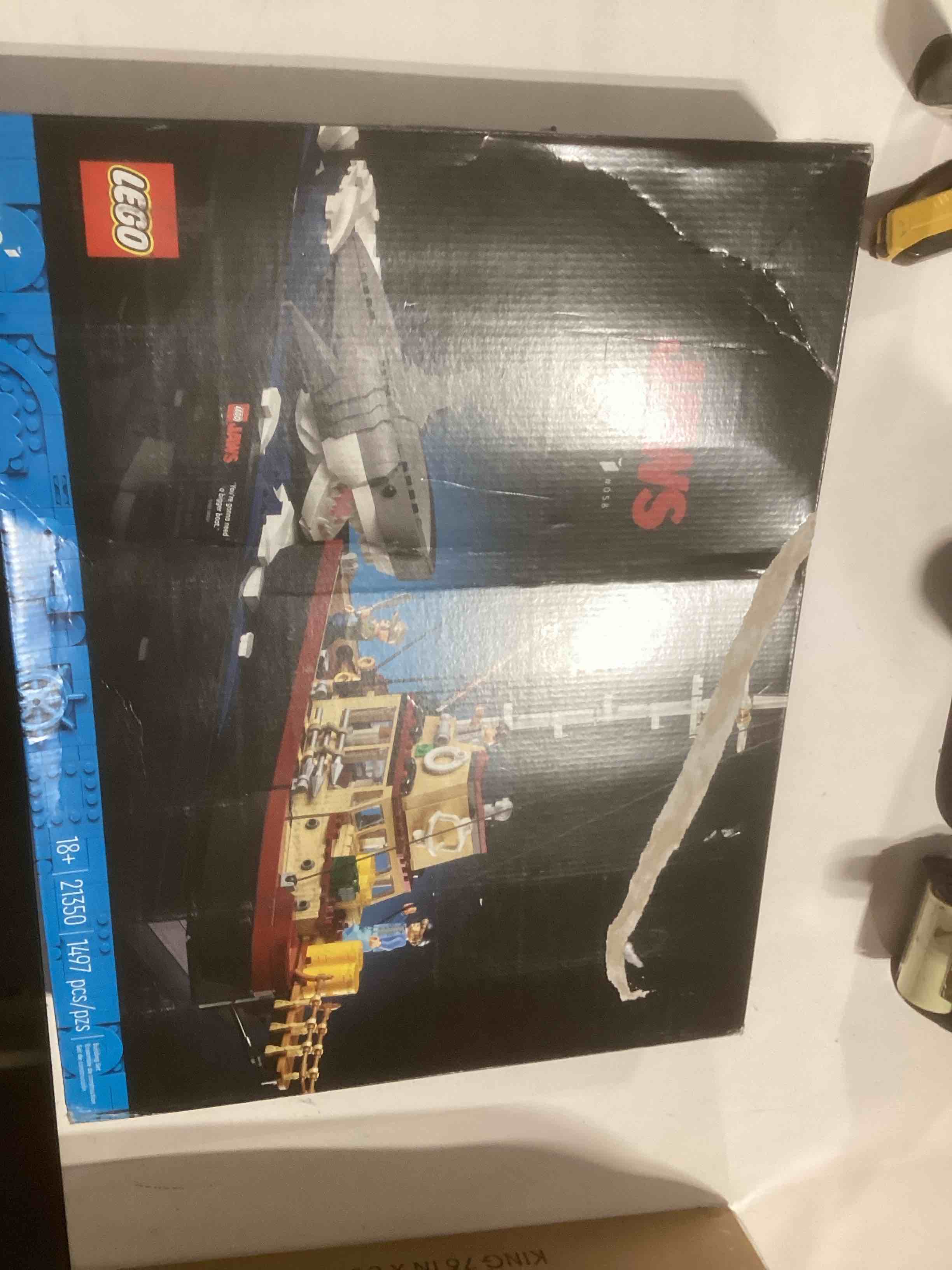 Condition photo showing New/Like New for LEGO Ideas Jaws Set - Diorama Kit for Fans of The Classic Movie - Shark Toy - Movie Memorabilia Gift for Adults - Includes Orca Boat and Chief Brody, Hooper and Quint Minifigures - 21350