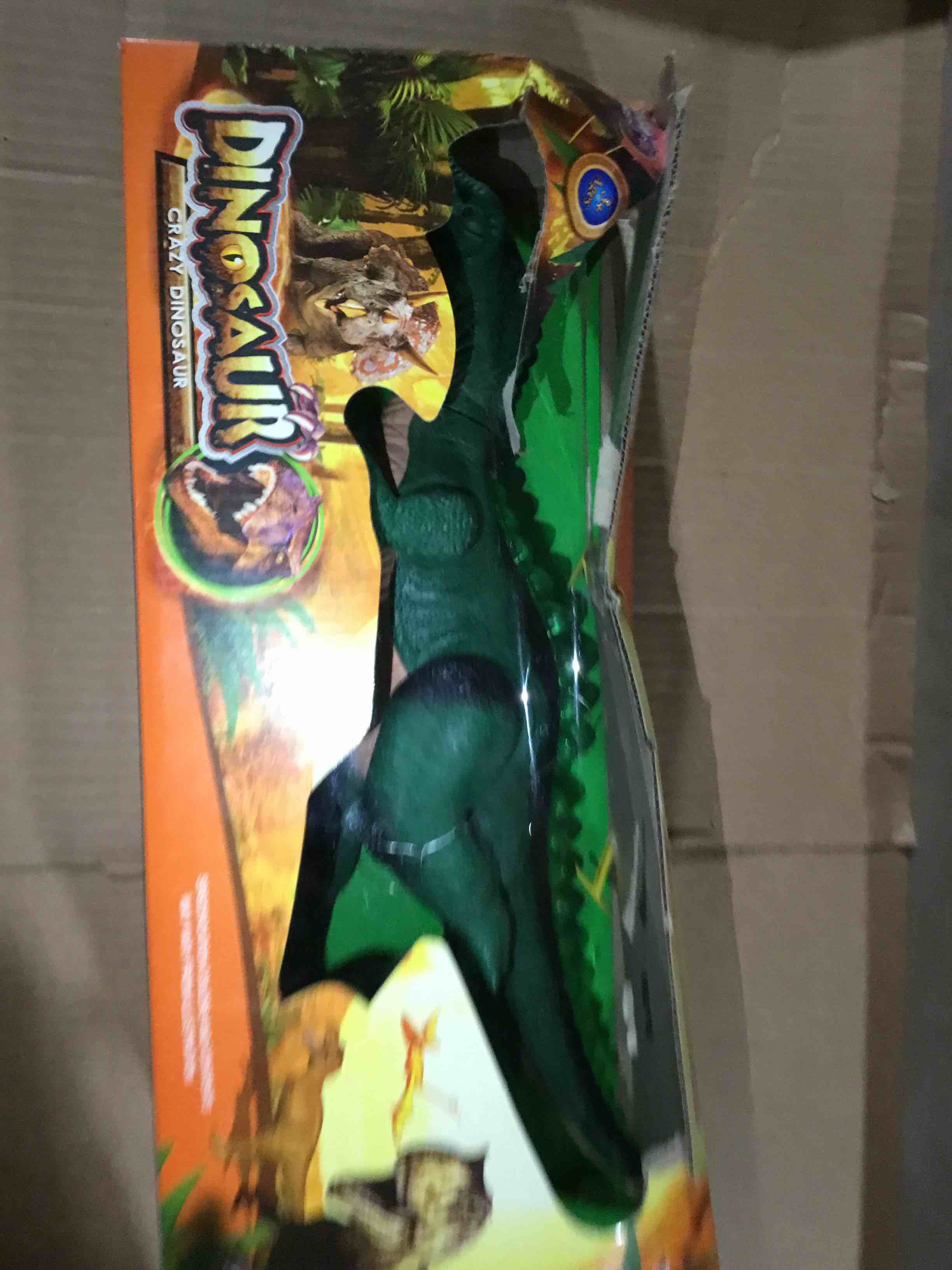 Condition photo showing Good Condition for Green plastic dinosaur toy in its display box with the label dinosaur crazy dinosaur 