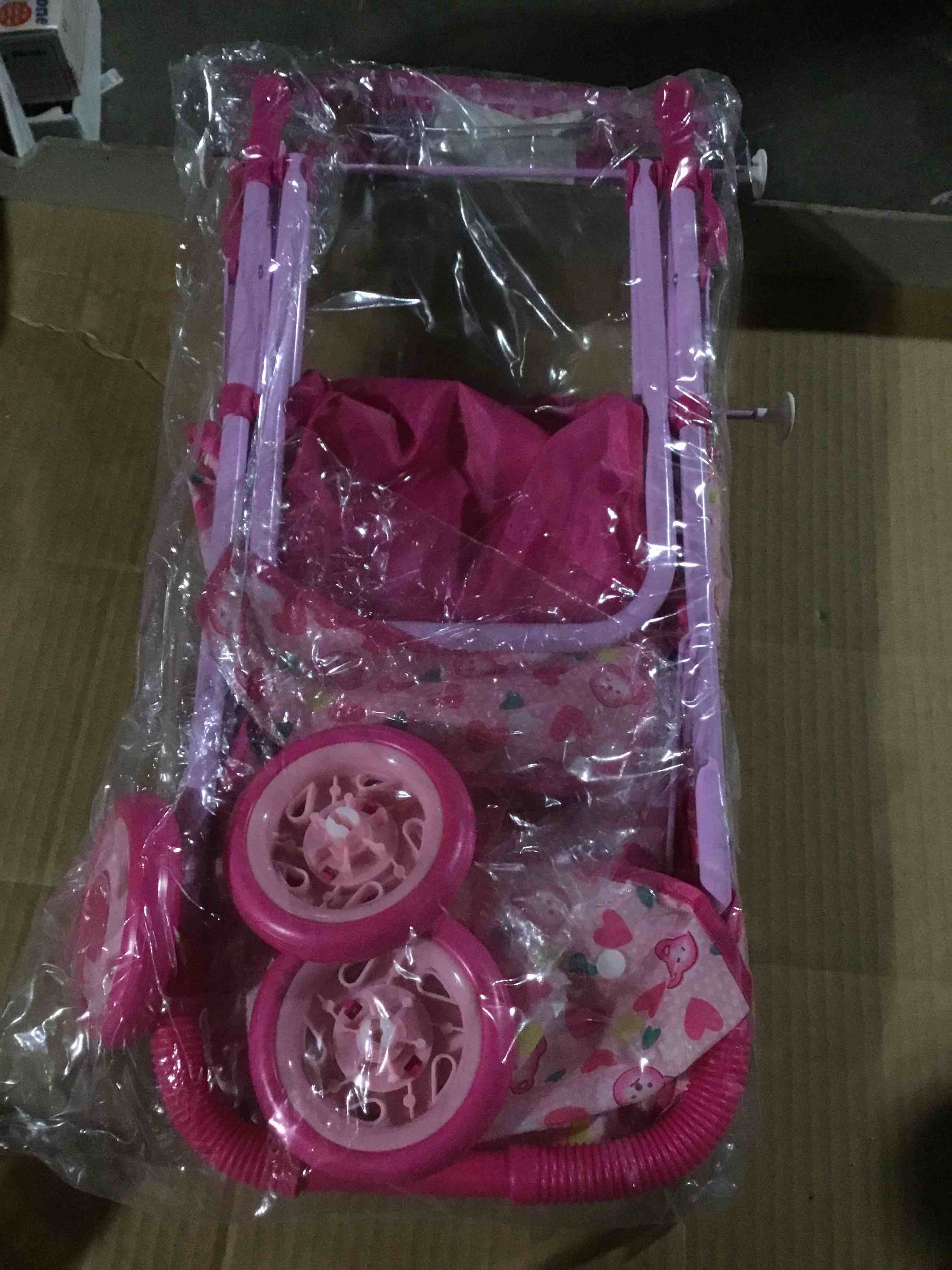 Toy stroller for dolls, pink and designed to look a real baby stroller ,manufactured by 5he Cathay doll brand