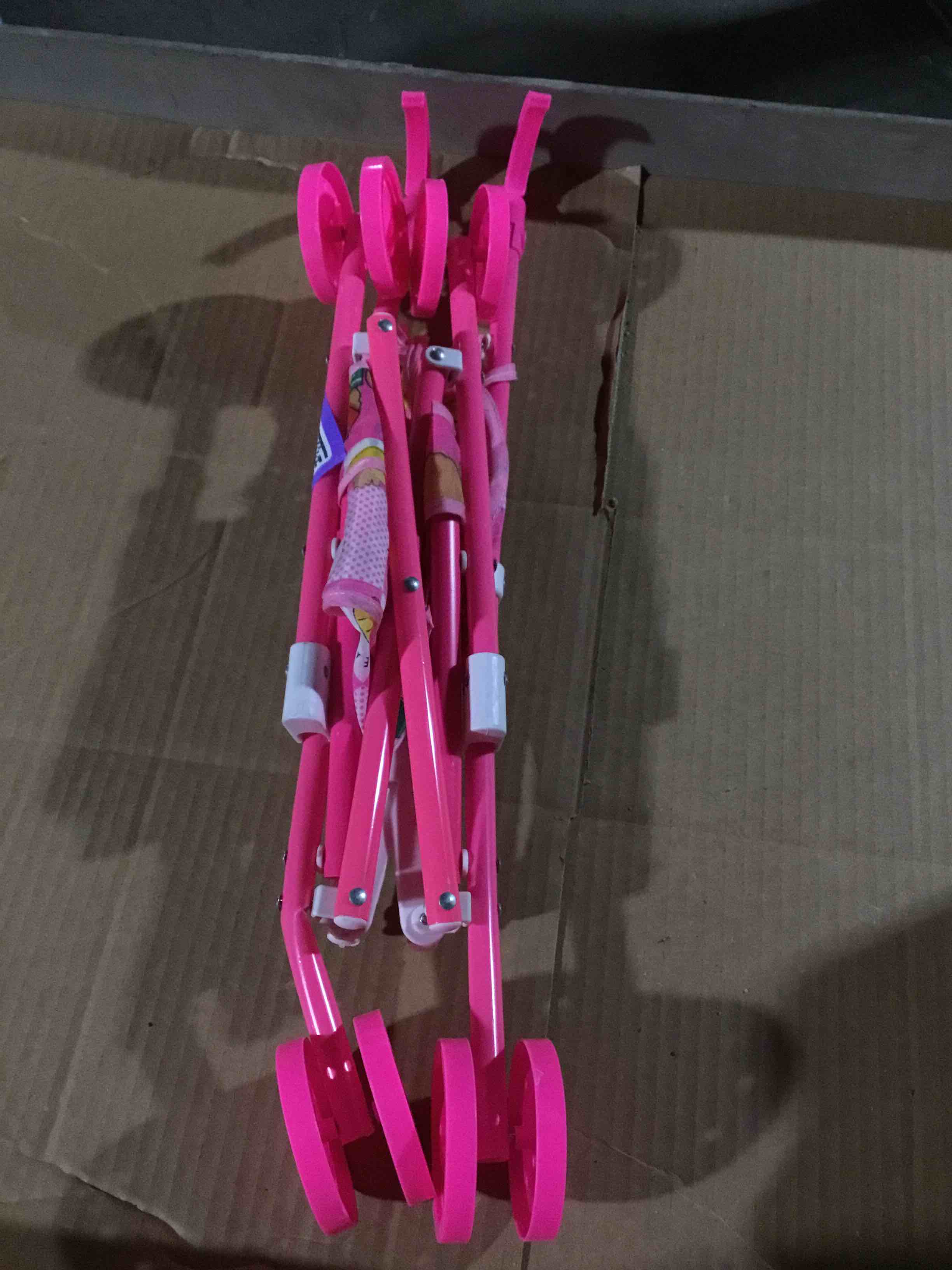 Condition photo showing As Is for Toy stroller for dolls, pink and designed to look a real baby stroller ,manufactured by 5he Cathay doll brand