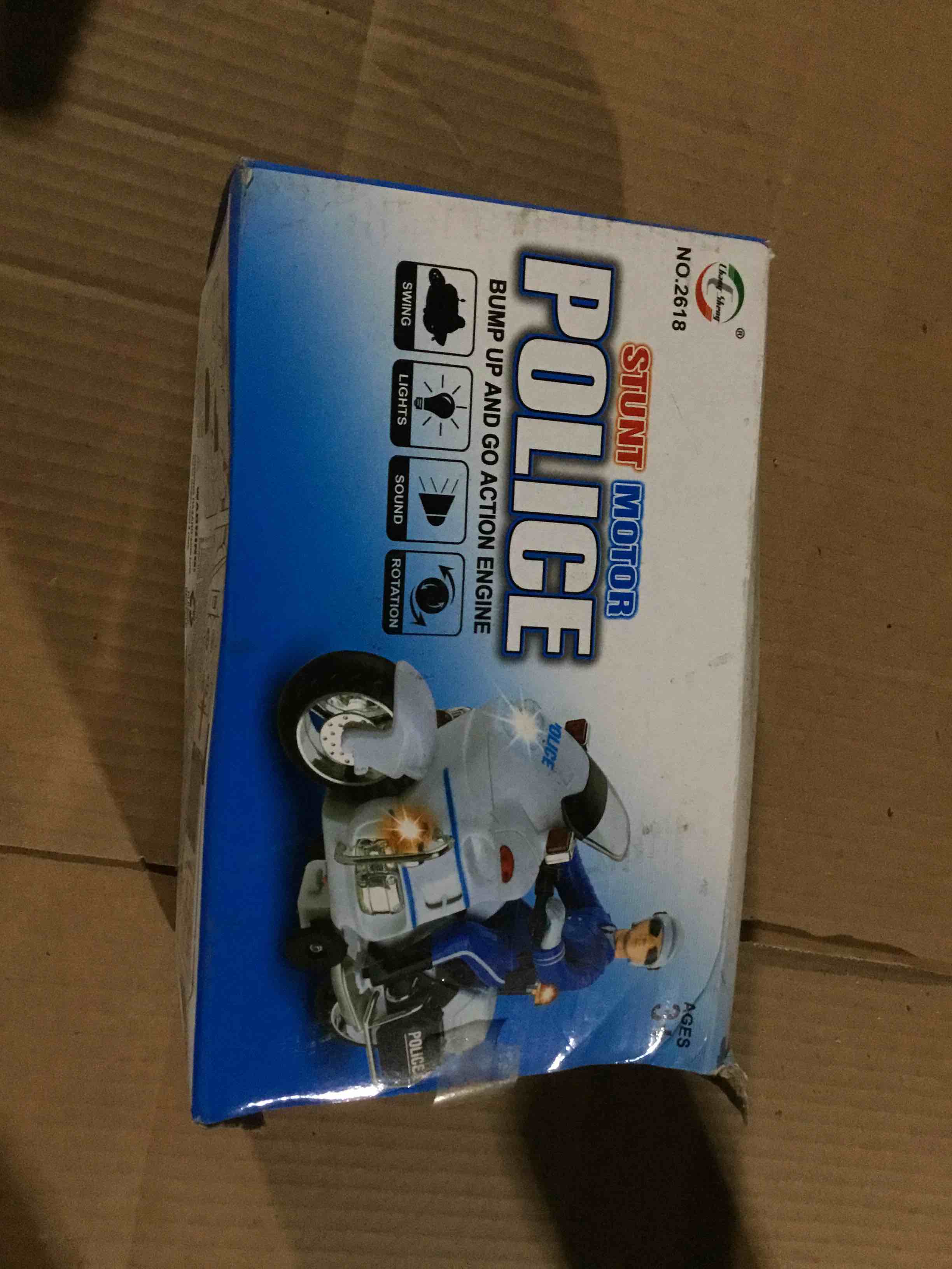 police acrobatic toy, model number no .2618. the toy works with batteries