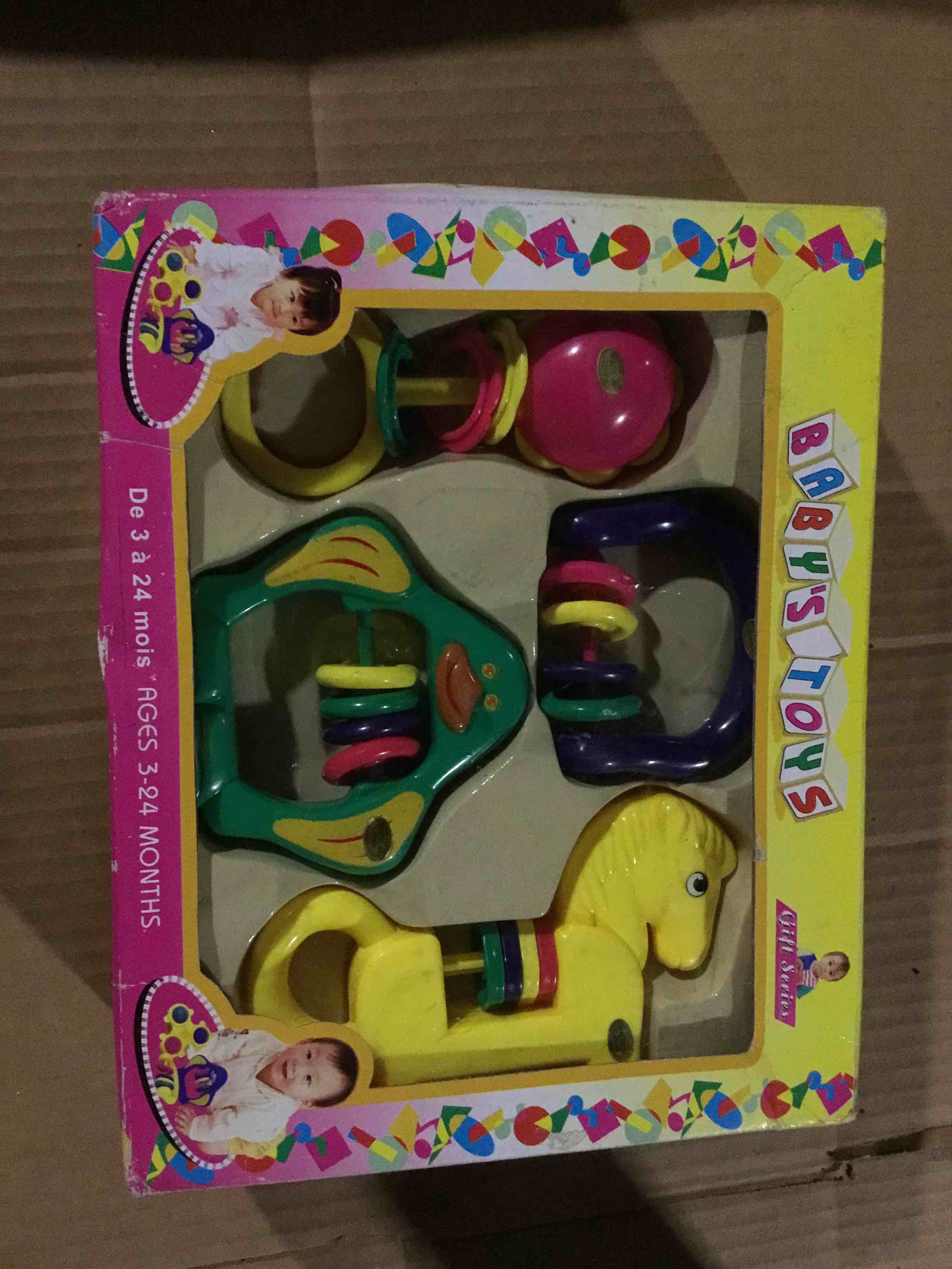 Condition photo showing Good Condition for BabyToys box containing a set of brightly colored plastic rattles and tetehers 