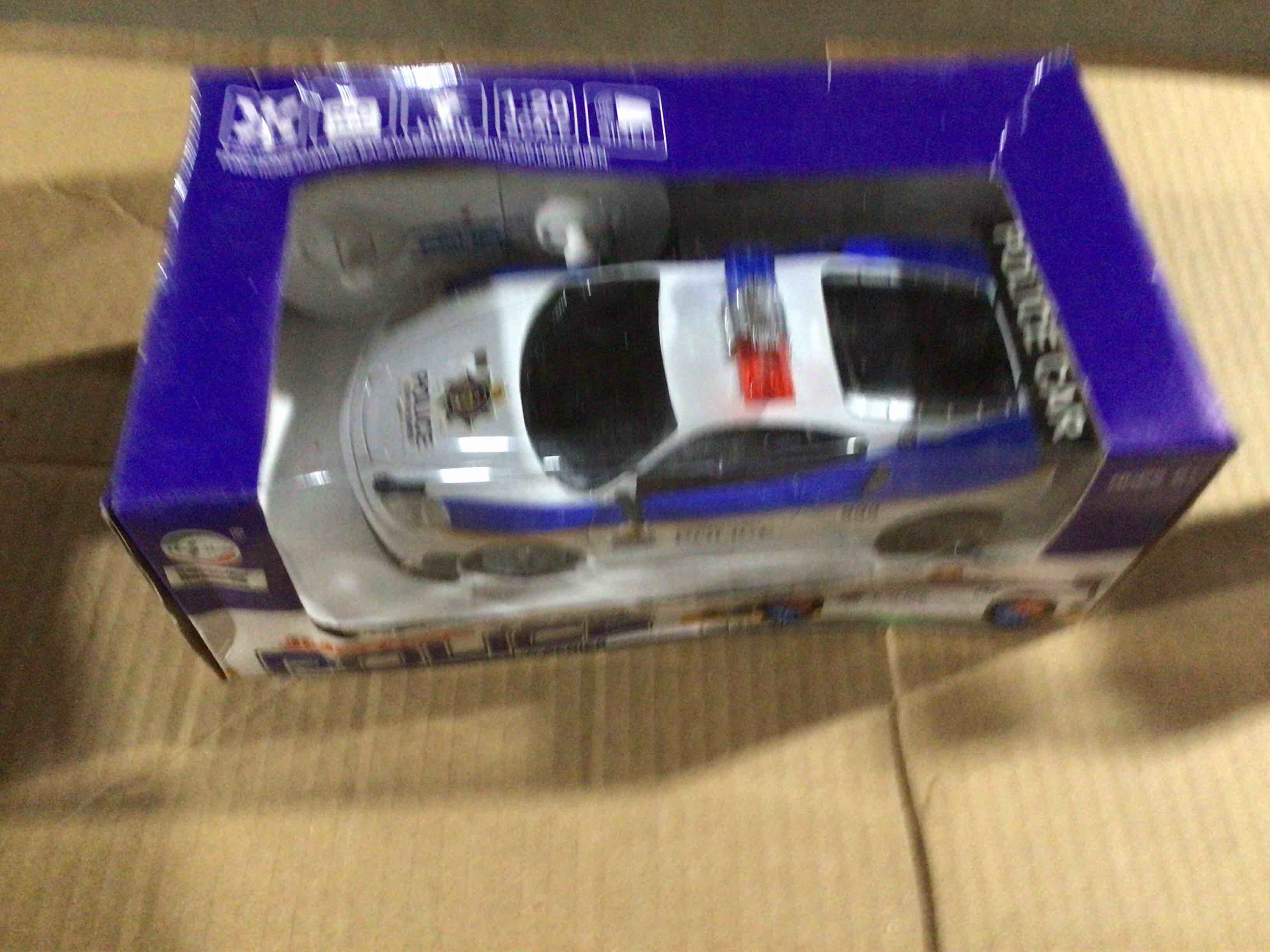 Toy in the image is a remote controlled police car