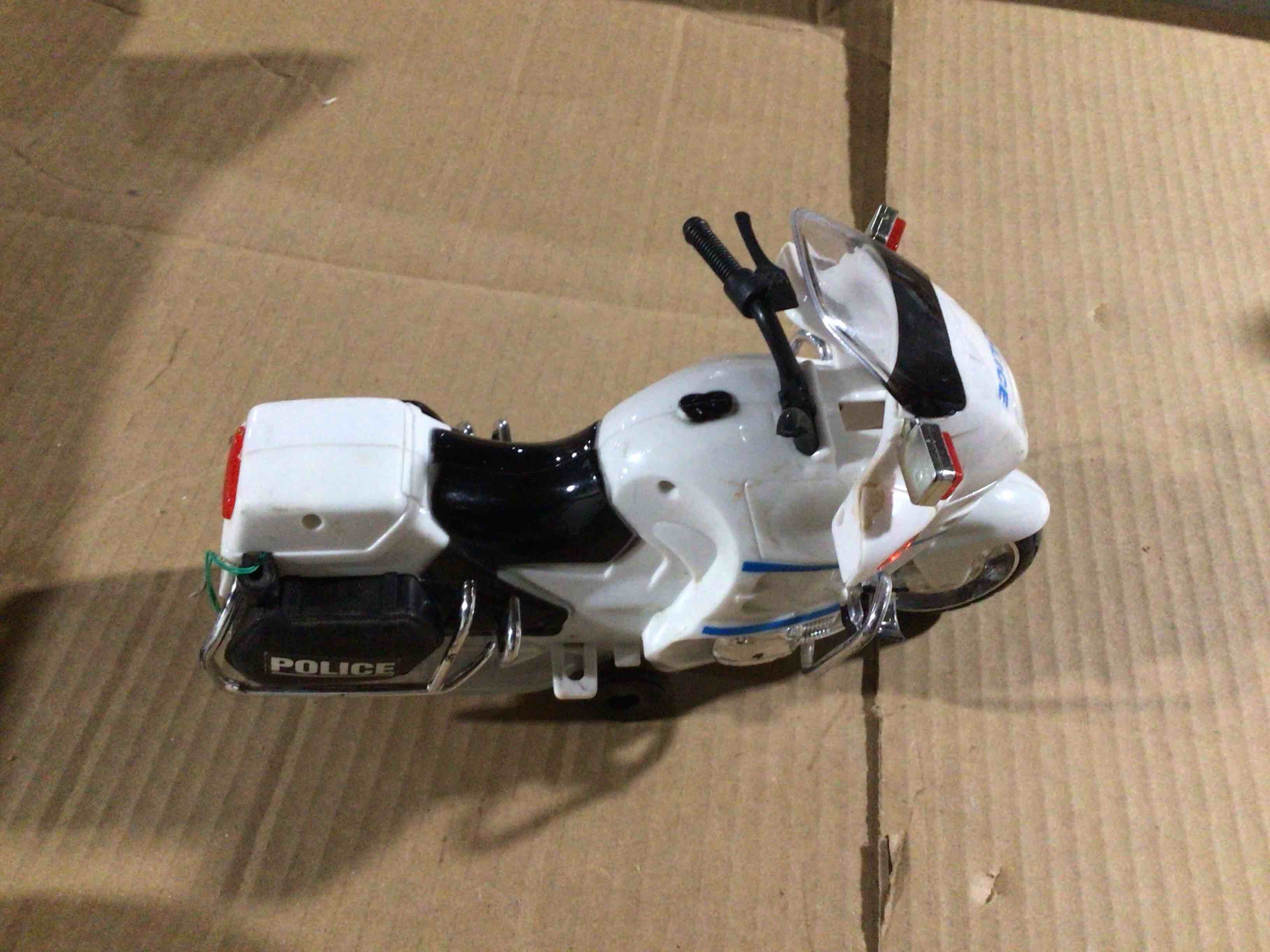 Toy police motorcycle with crun and move forward action