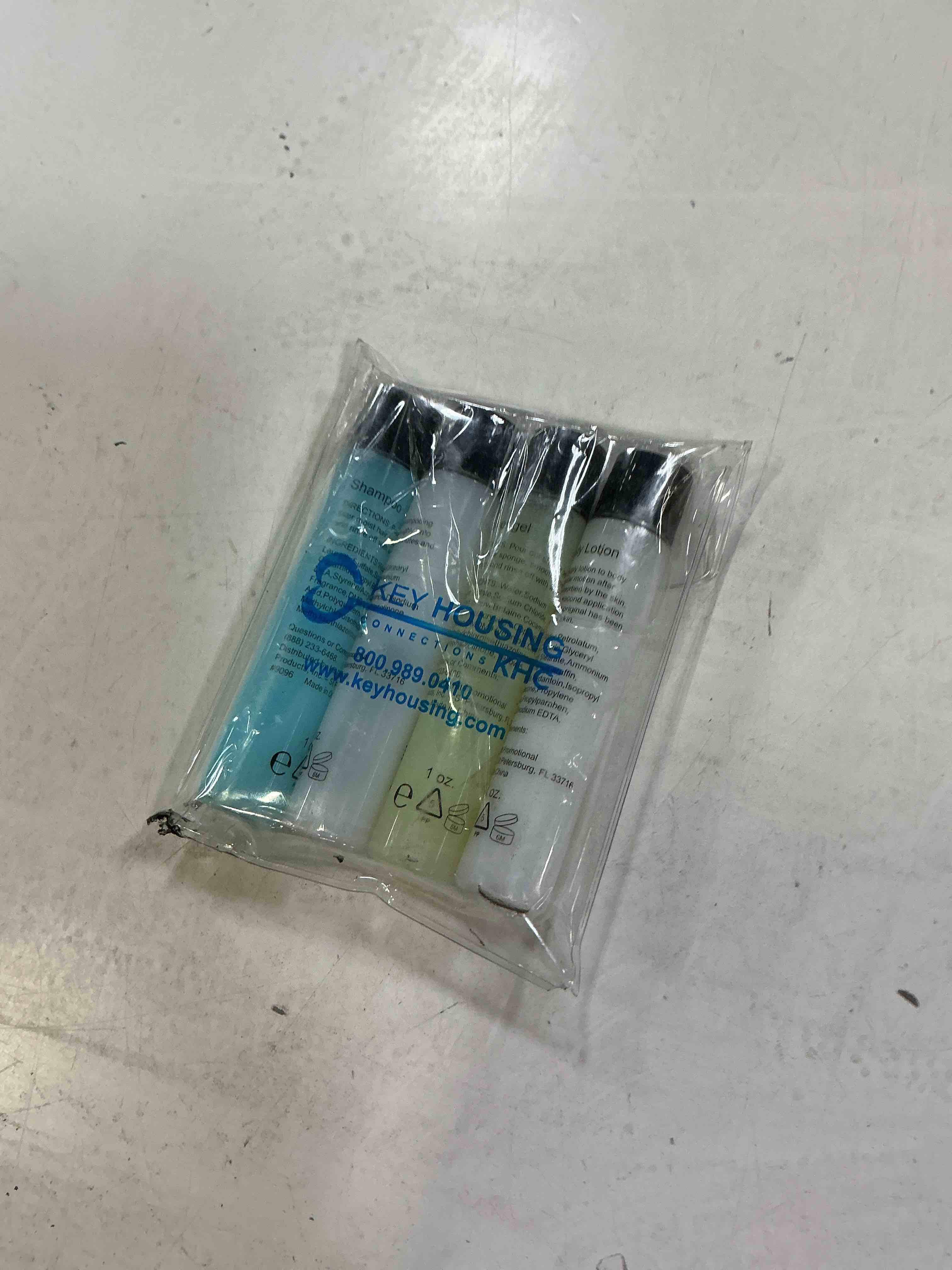 Condition photo showing New/Like New for 4-piece travel amenities kit