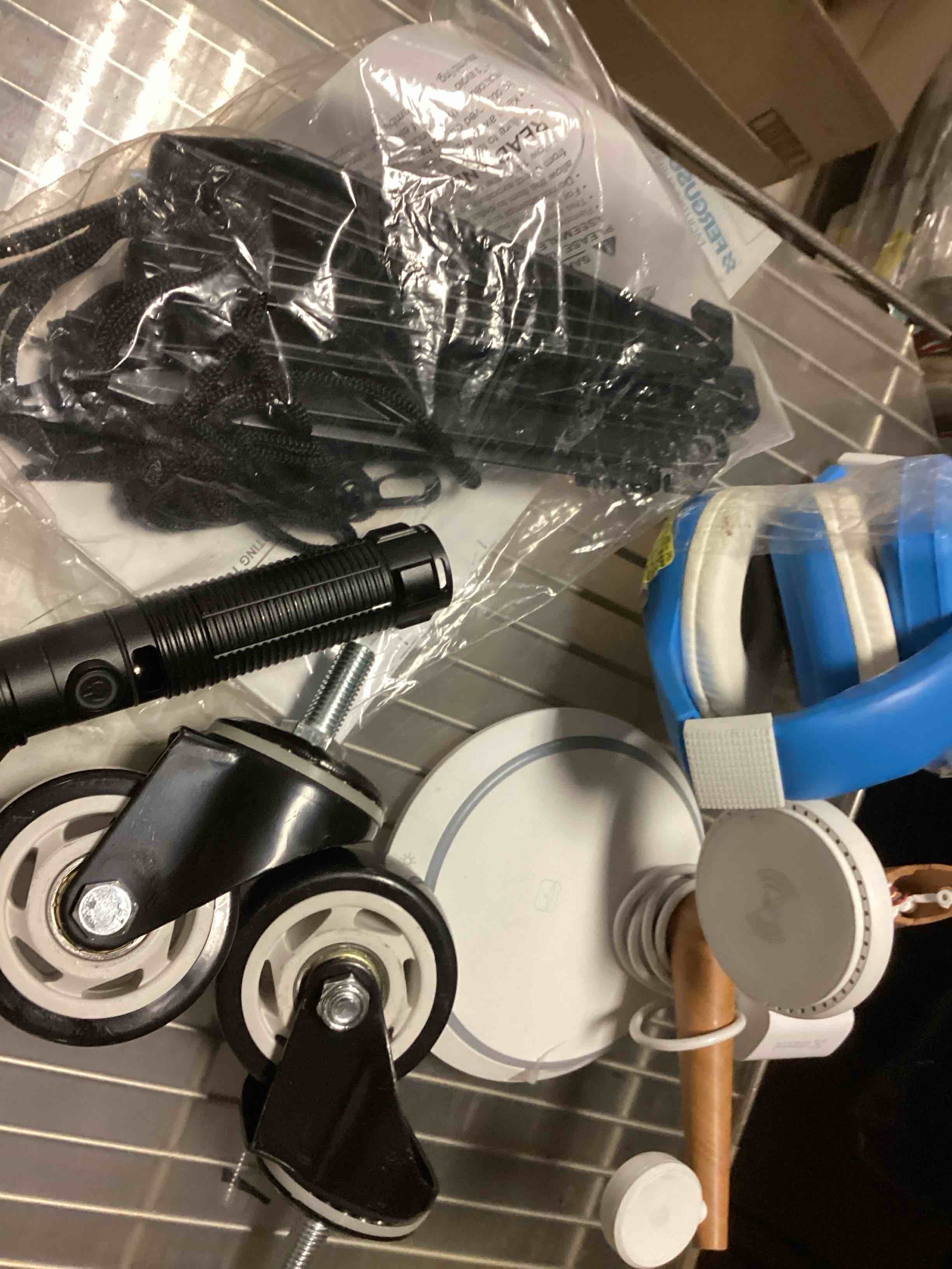 assorted items charger, headphones and more