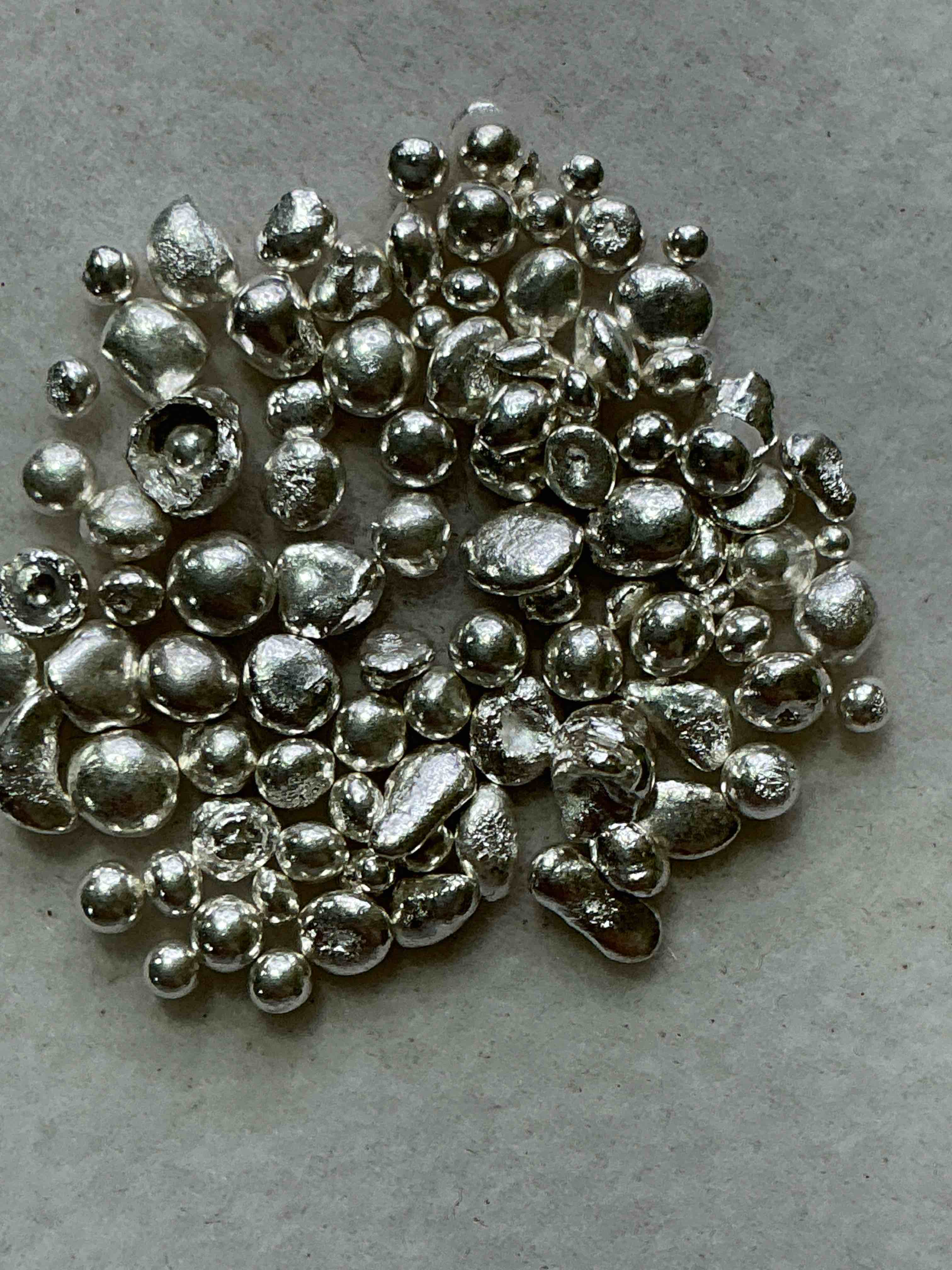 silver nuggets! .999 us fine silver, in small nugget form! total weight of all nuggets in lot approximately 6 grams, bid is per nugget! a cool way to invest in fine us silver! includes collector capsule!