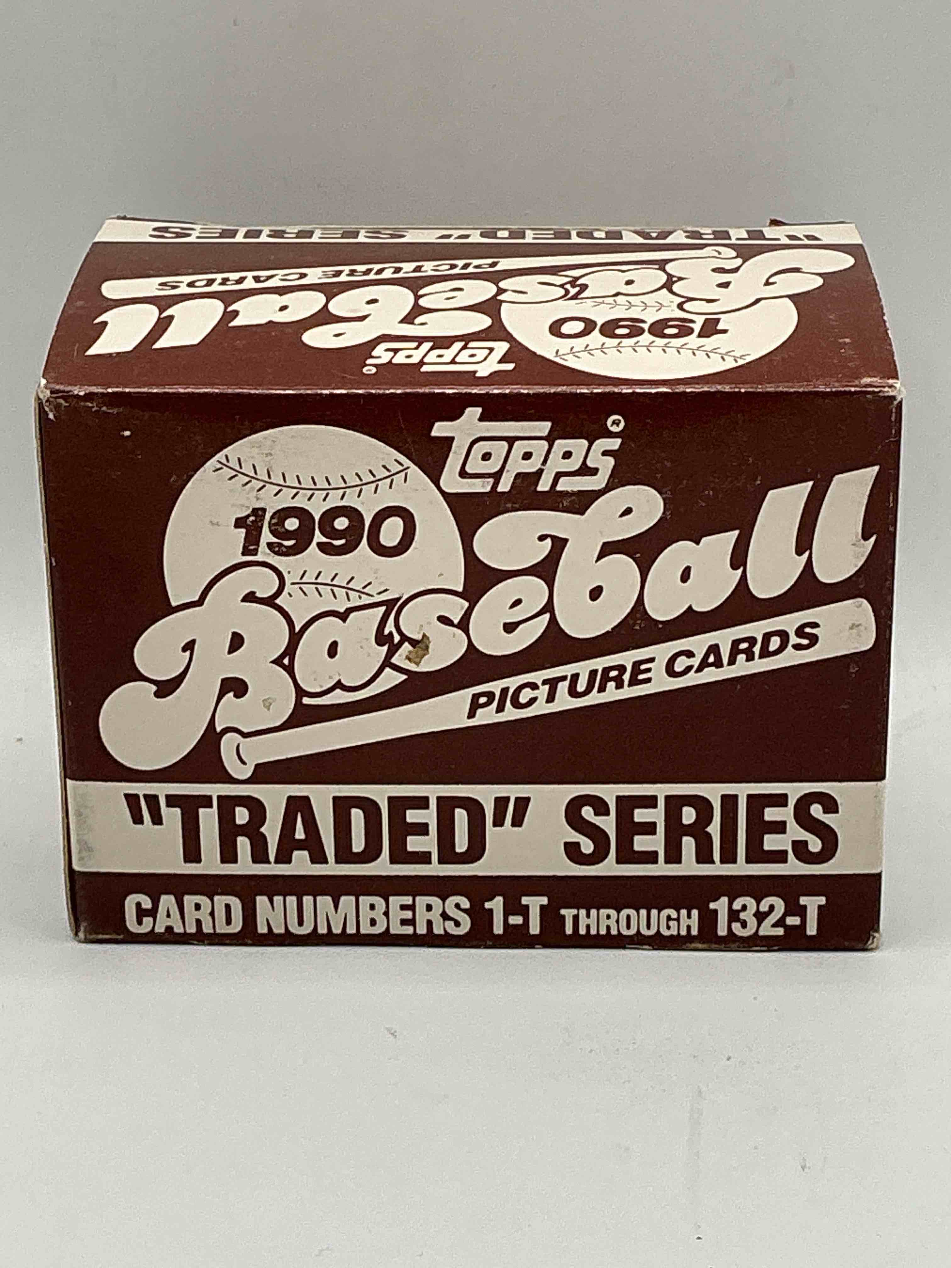 1990 topps baseball card complete unopened traded series, card numbers 1-t through 132-t. set is unopened (these sets were never factory sealed in plastic from manufacturer). set includes david justice traded rookie. great sports card memorabilia!