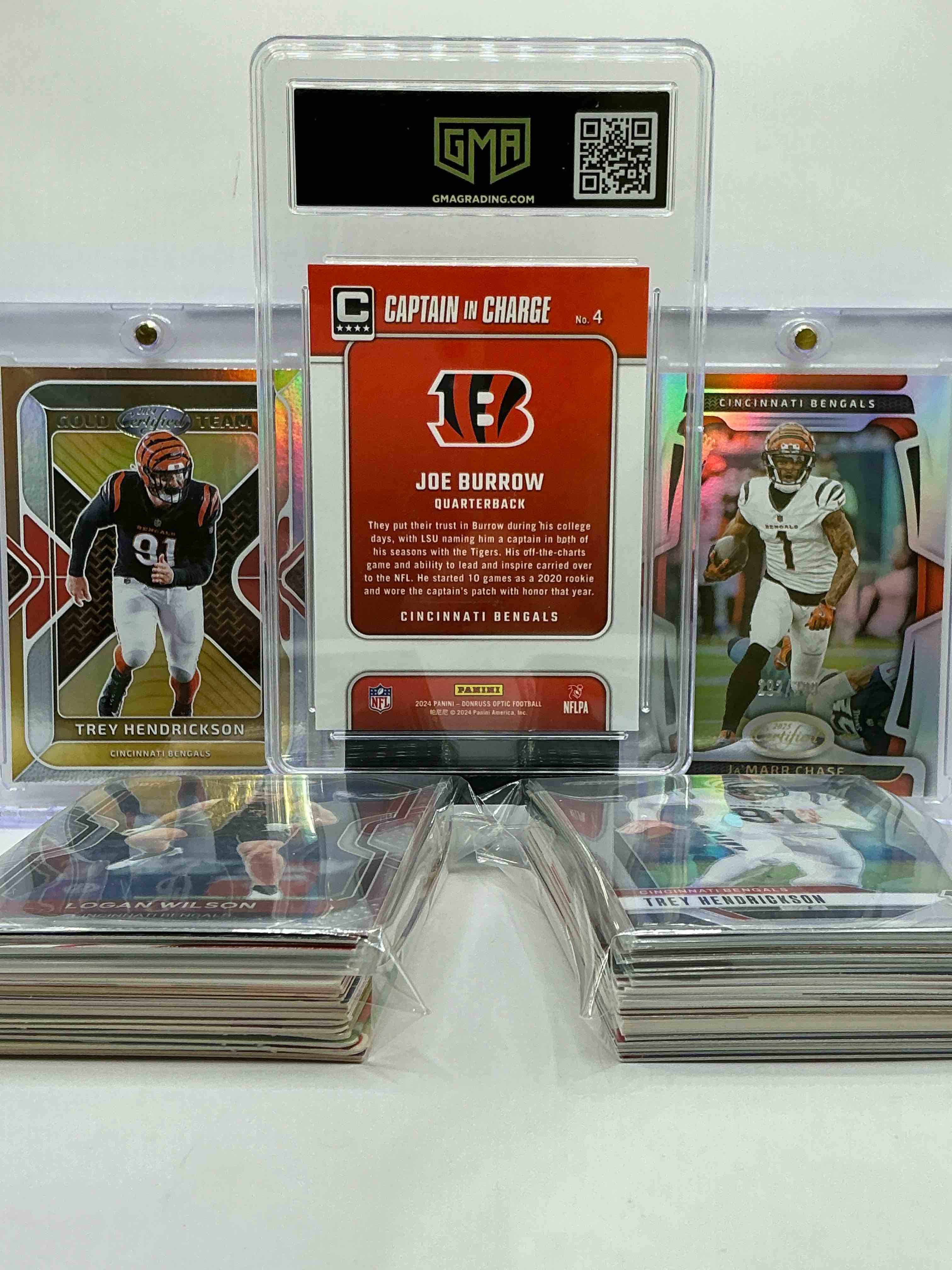 Condition photo showing New/Like New for joe burrow optic captain in charge gem mint 10 card, ja’marr chase /399 certified, trey hendrickson certified & more! wow! bengals bonanza! filled with commons, legends, heroes, vintage & new cards & more! 50 card lot!