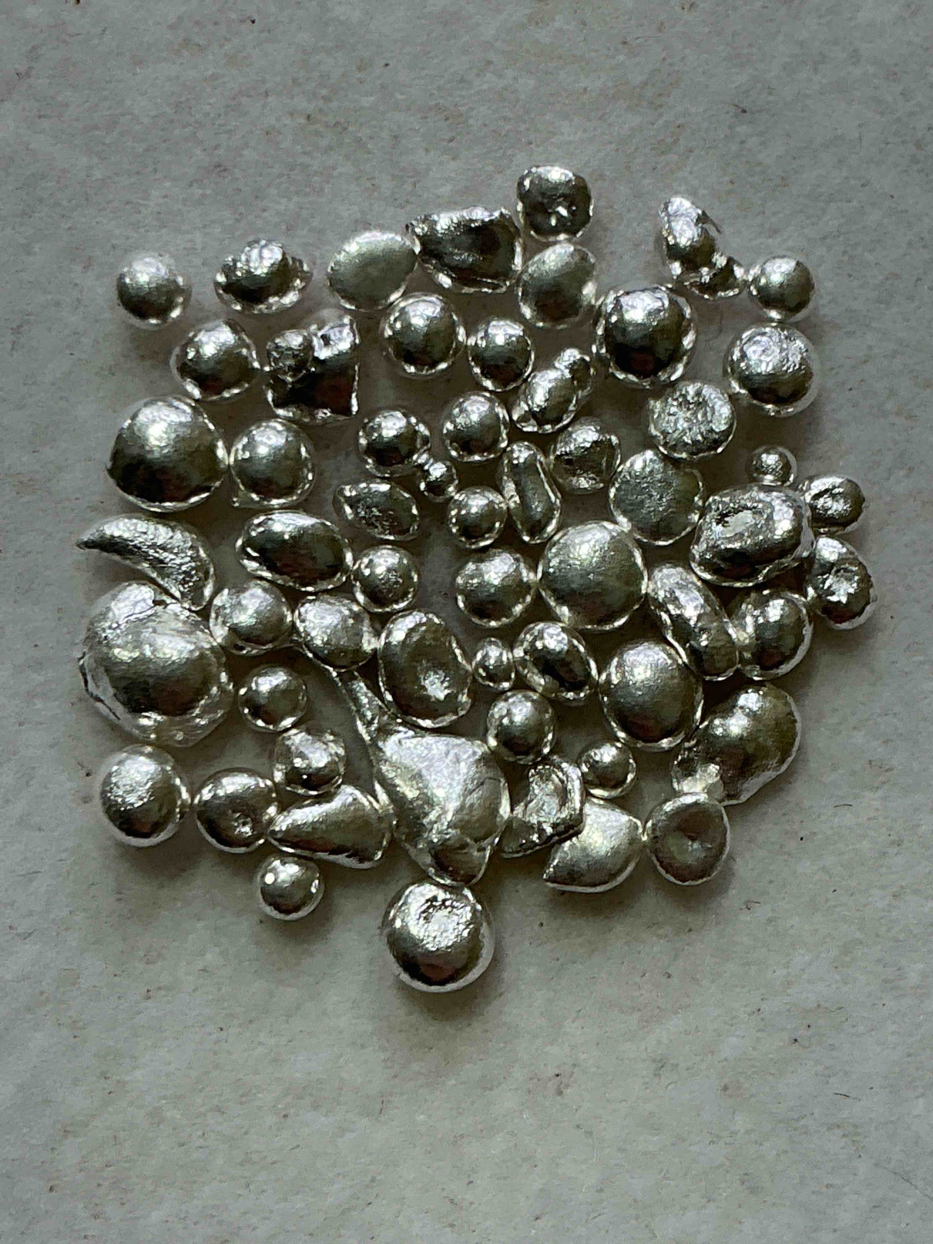 silver nuggets! .999 us fine silver, in small nugget form! total weight of all nuggets in lot approximately 6 grams, bid is per nugget! a cool way to invest in fine us silver! includes collector capsule!