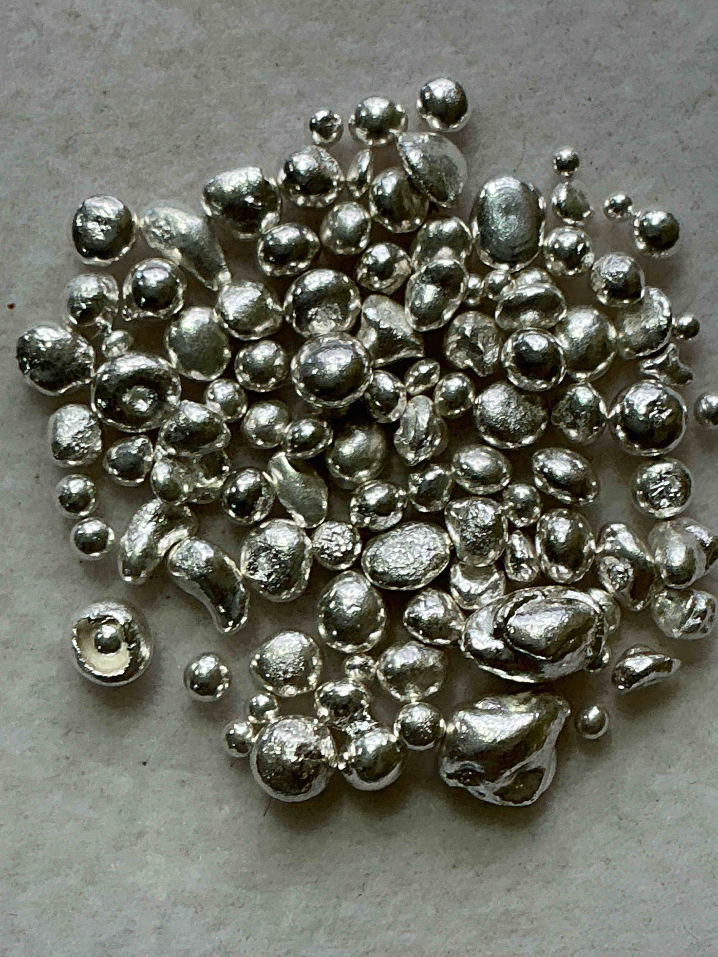 silver nuggets! .999 us fine silver, in small nugget form! total weight of all nuggets in lot approximately 6 grams, bid is per nugget! a cool way to invest in fine us silver! includes collector capsule!