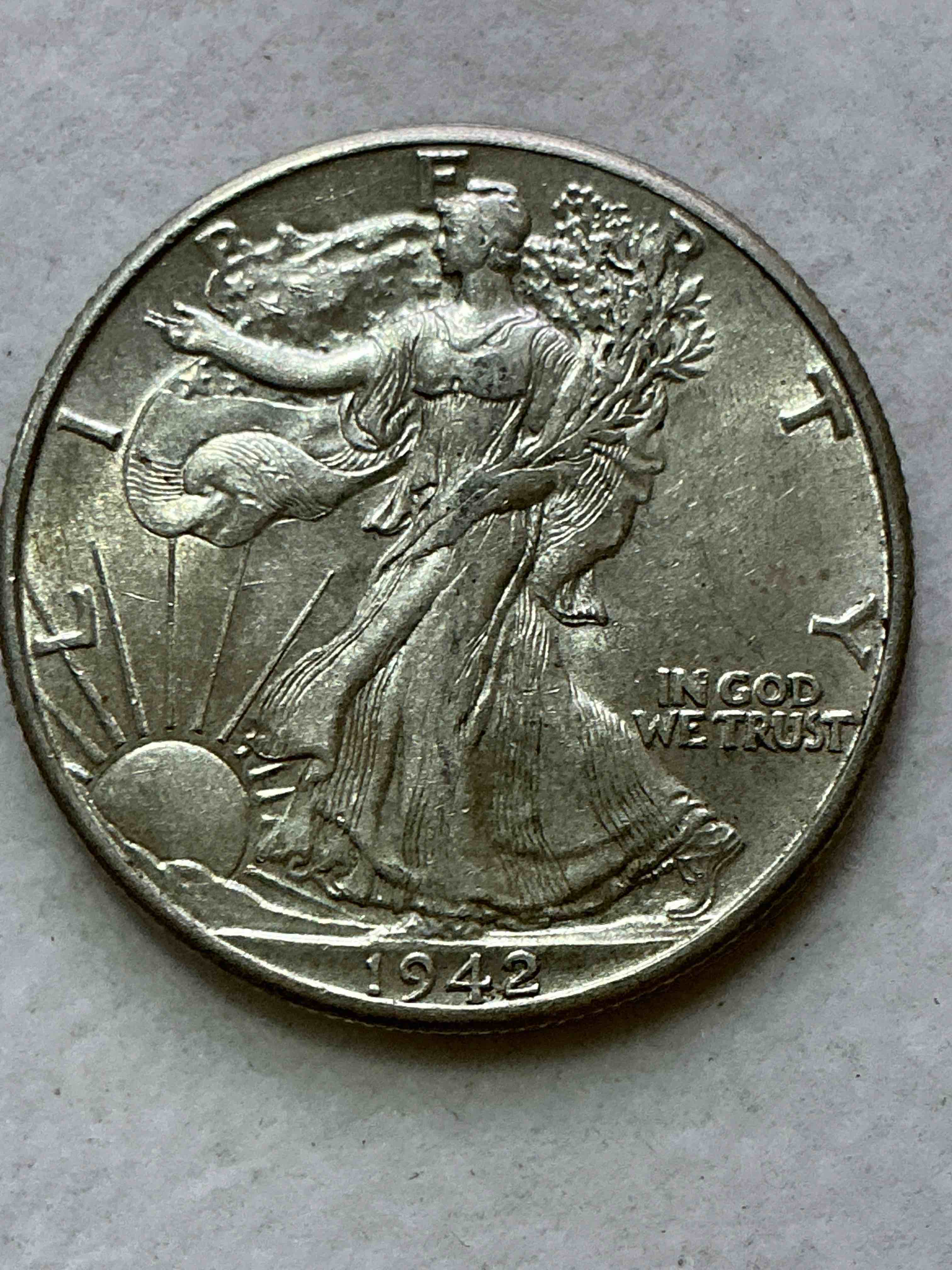 world war ii era silver! antique u.s. silver! liberty walking silver fine u.s. silver half dollar! this striking half dollars were minted from 1916-1947 & have become some of the most collectible coins in history! here is a striking appears uncirculated example from 1942! liberty walking coins are 90% fine u.s. silver, a great investment in precious metal!