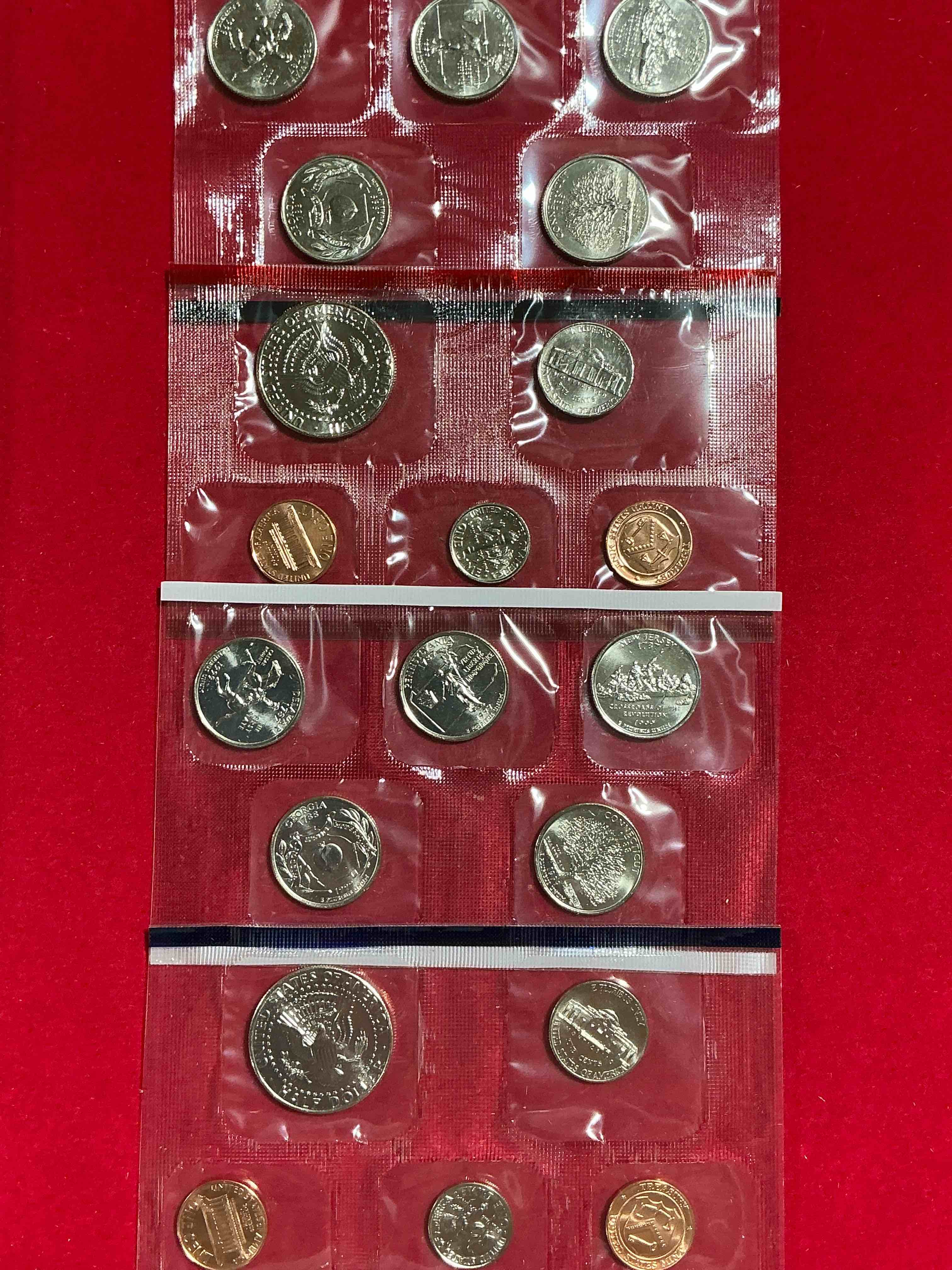 Condition photo showing New/Like New for 1999 uncirculated mint set coins! 20 coin mint set from philadelphia & denver! 20 coin uncirculated lot, with quarters, nickels, half dollars, dimes, pennies & more! uncirculated coin craziness!