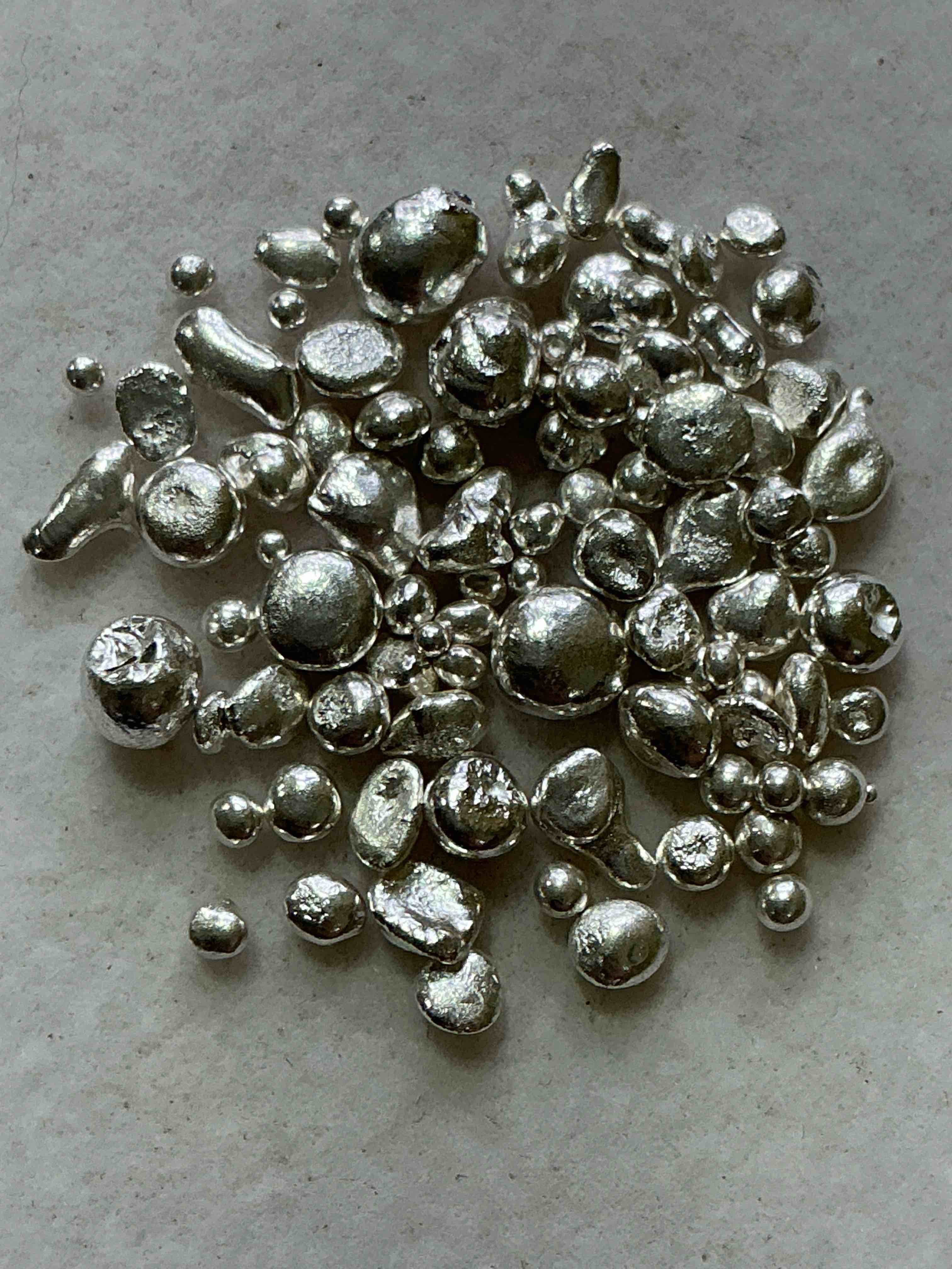 silver nuggets! .999 us fine silver, in small nugget form! total weight of all nuggets in lot approximately 6 grams, bid is per nugget! a cool way to invest in fine us silver! includes collector capsule!