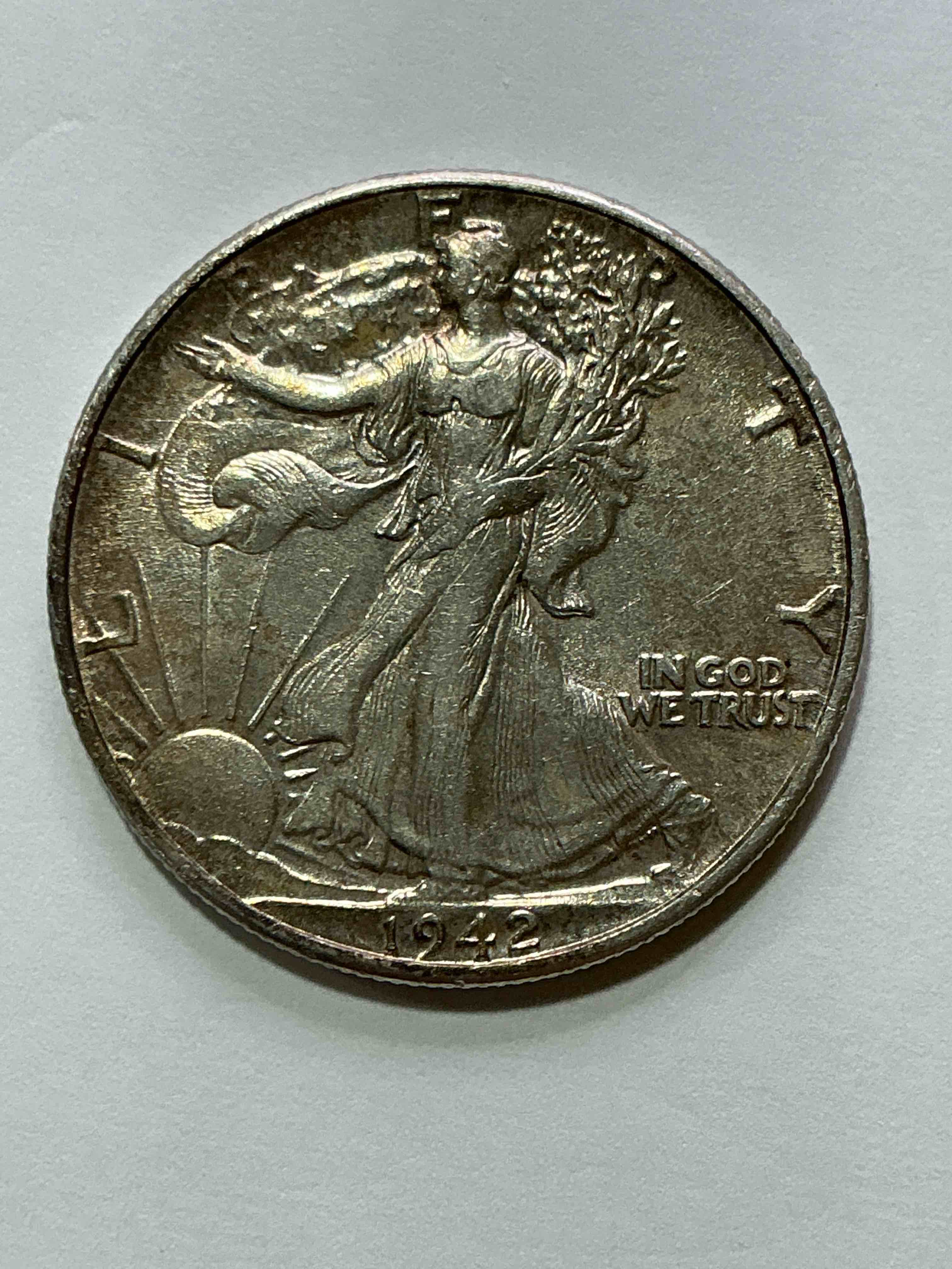 world war ii era silver! antique u.s. silver! liberty walking silver fine u.s. silver half dollar! this striking half dollars were minted from 1916-1947 & have become some of the most collectible coins in history! here is a striking appears uncirculated example from 1942! liberty walking coins are 90% fine u.s. silver, a great investment in precious metal!