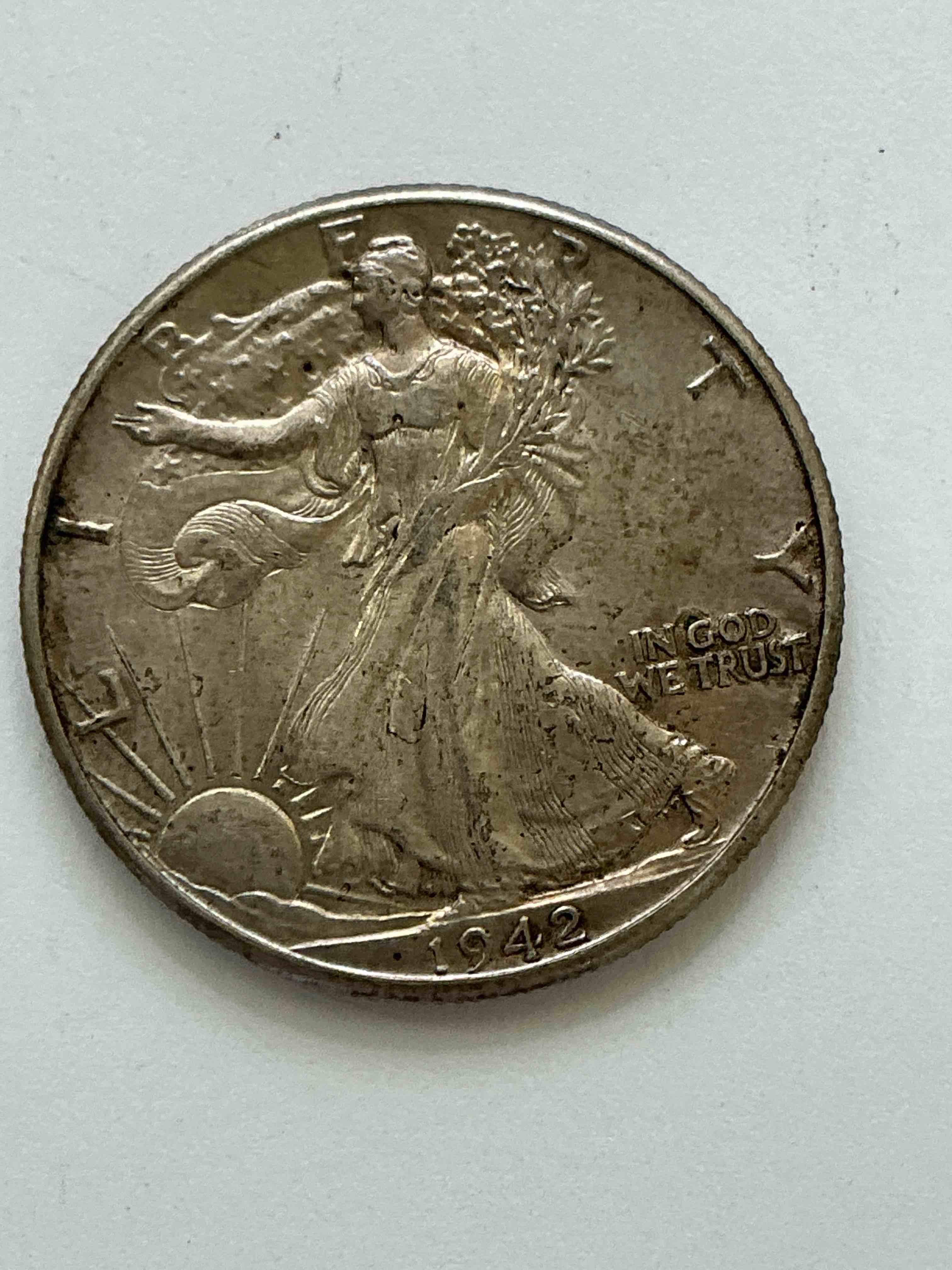 world war ii era silver! antique u.s. silver! liberty walking silver fine u.s. silver half dollar! this striking half dollars were minted from 1916-1947 & have become some of the most collectible coins in history! here is a striking appears uncirculated example from 1942! liberty walking coins are 90% fine u.s. silver, a great investment in precious metal!