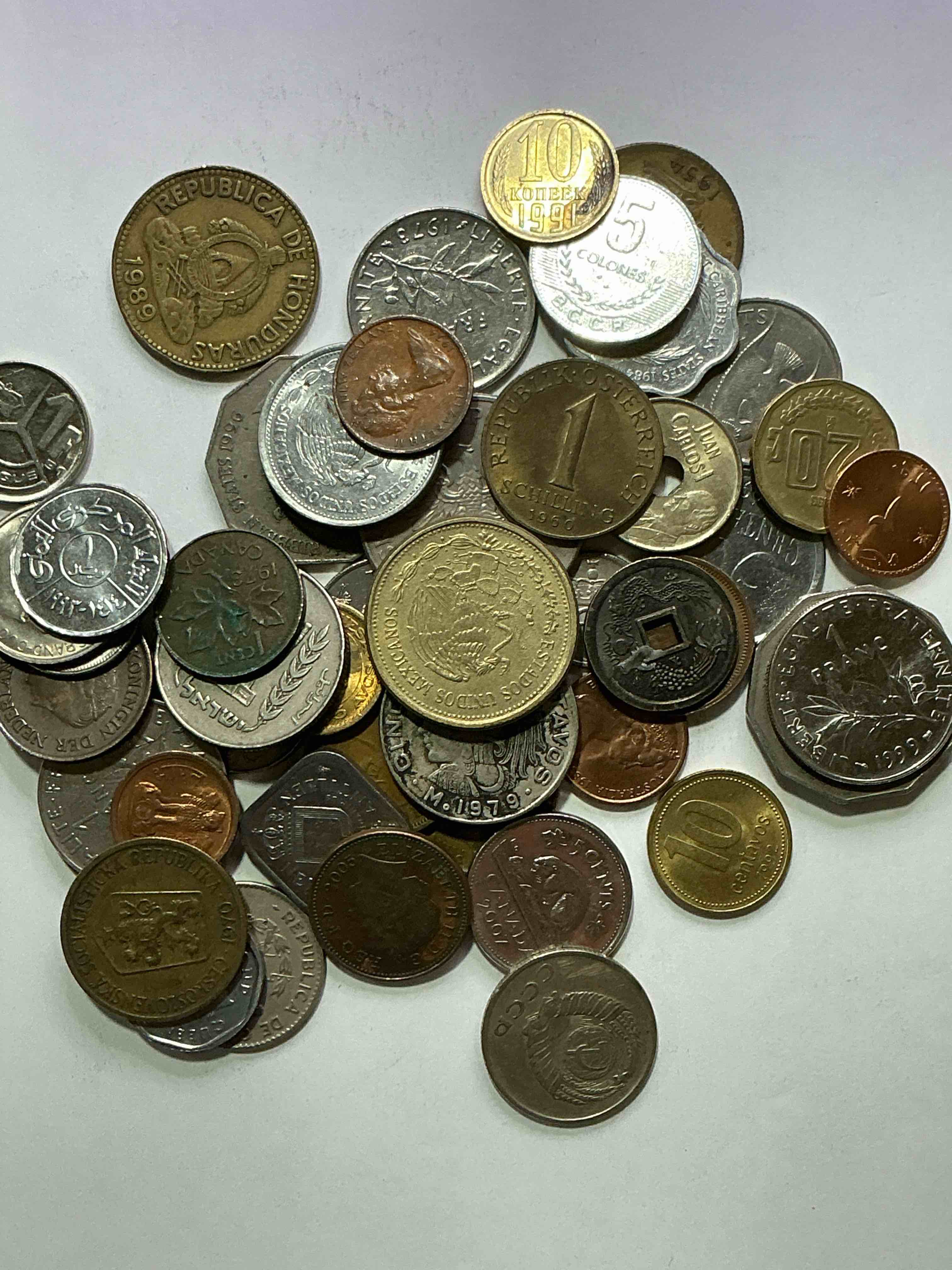 Condition photo showing Good Condition for world coins, antique & vintage! each lot is unique! many different years, countries, sizes & exotic places. this cool collection of antique coins from around the world is loads of fun! have fun identifying each coin & country as a great educational tool! a great investment too!