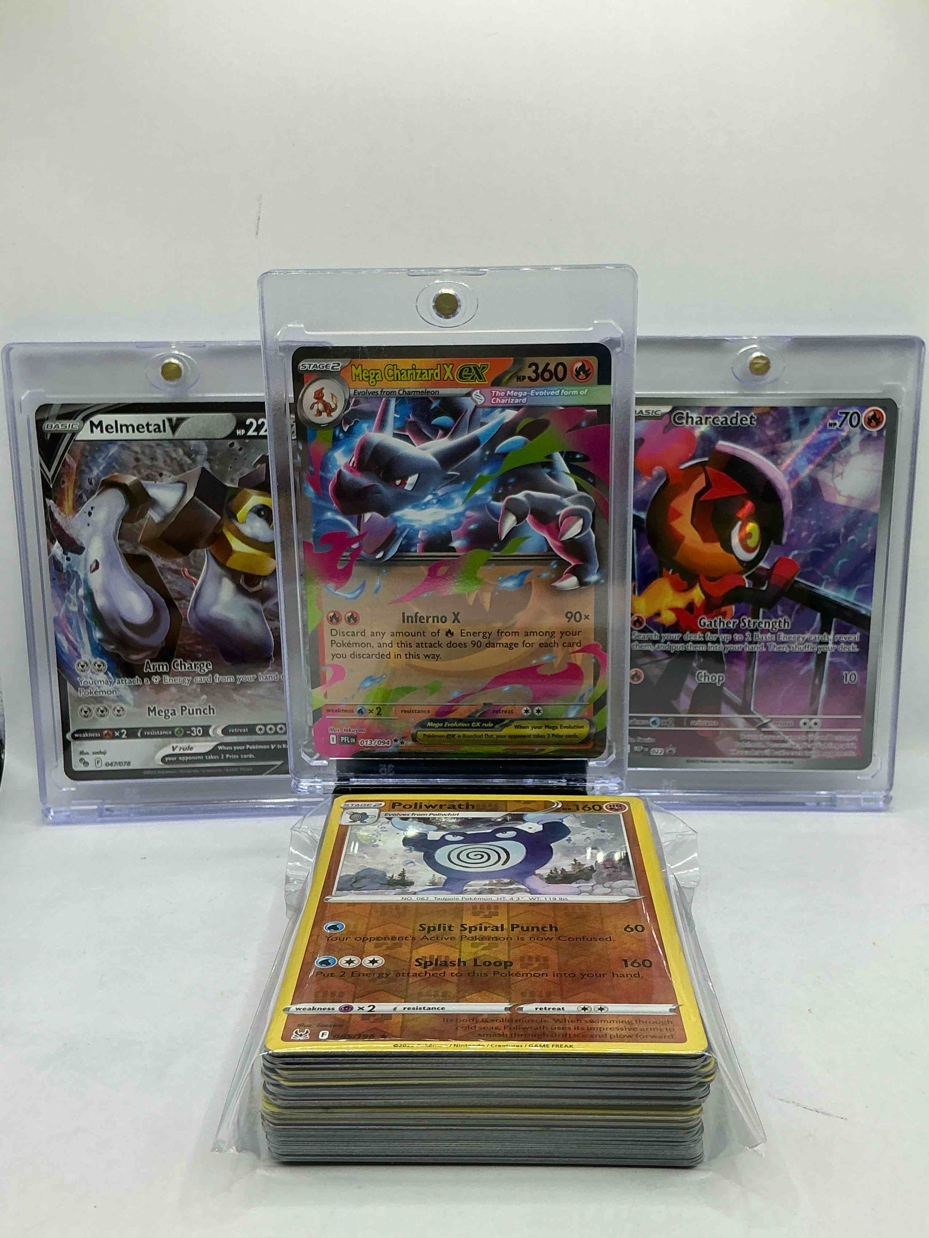 Pokémon! This Pack Includes Mega Charizard EX, Melmetal V, & Full Art Charcadet! Along With 50 Other Pokémon Heroes, Holos, Legends & Commons- Including 1 Stage Two Rare Holographic, 2 Stage One Rare Holographic, 3 Basic Rare Holographic, 4 Common/ Uncommon Holographics (All Stages), 2 Stage Two Non Holographic & 2 Rares! Also Includes 36 Non Holo Common/ Uncommon Basic & First Stage Cards Trainers & Energy Too! Perfect Set For Collectors & Enthusiasts!