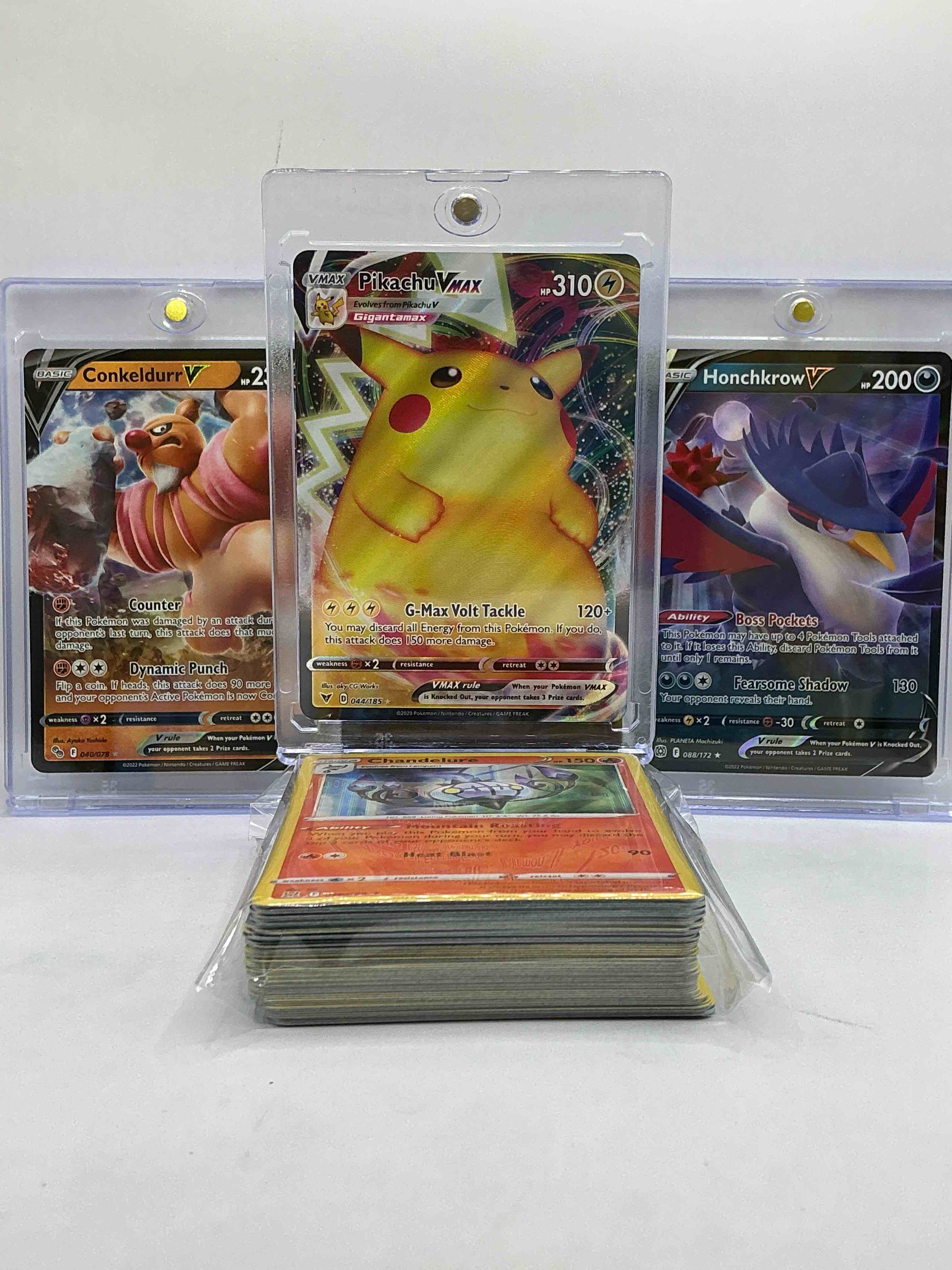 Pikachu VMAX Holo, Conkeldurr V, Honchkrow V & More! Wow! Insane Trio! Along With 50 Other Pokémon Heroes, Holos, Legends & Commons- Including 1 Stage Two Rare Holographic, 2 Stage One Rare Holographic, 3 Basic Rare Holographic, 4 Common/ Uncommon Holographics (All Stages), 2 Stage Two Non Holographic & 2 Rares! Also Includes 36 Non Holo Common/ Uncommon Basic & First Stage Cards Trainers & Energy Too! Perfect Set For Collectors & Enthusiasts!