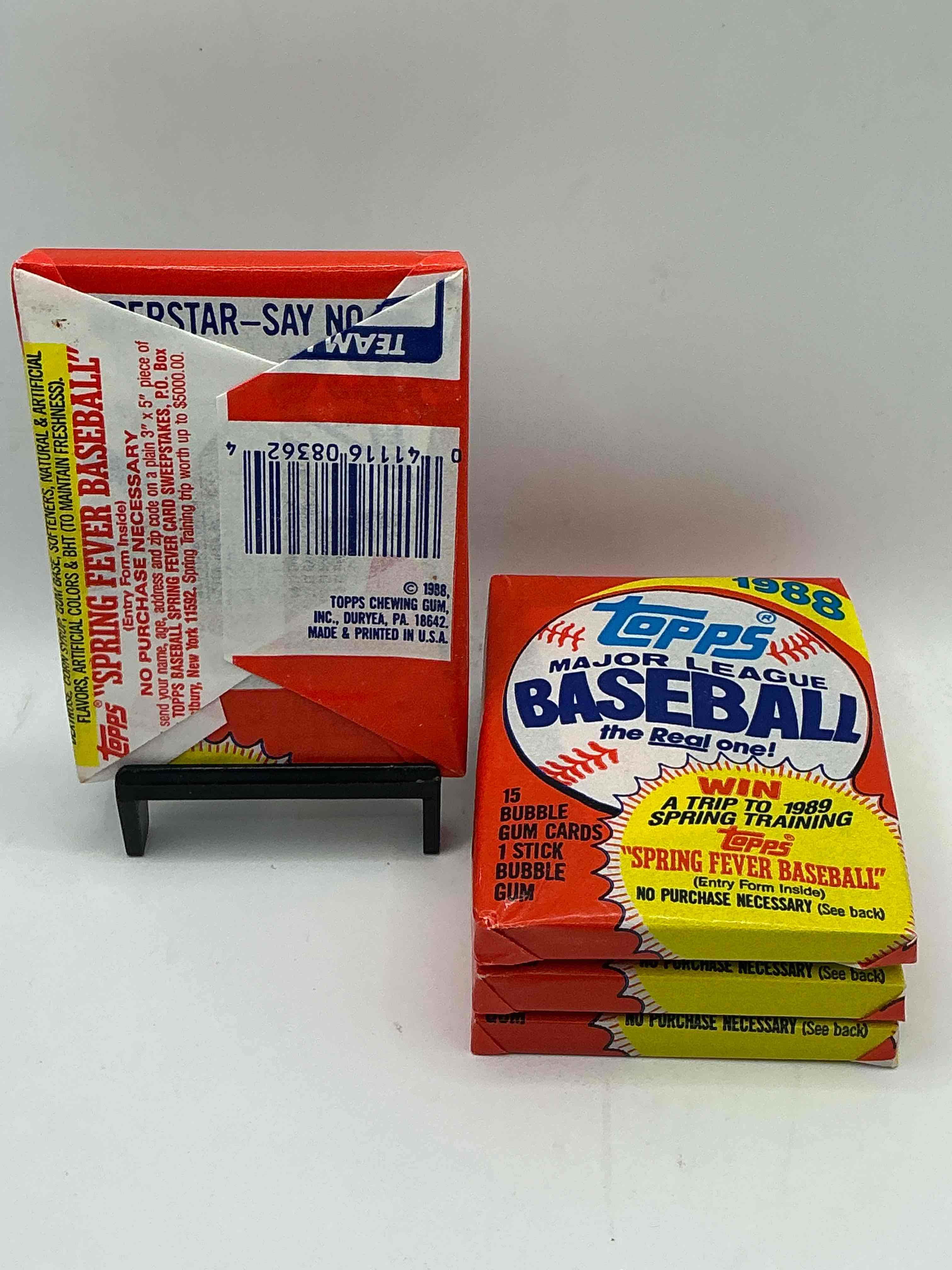 Condition photo showing New/Like New for 80's baseball fan's rejoice! 1988 topps baseball unopened wax packs full of collectible trading cards! search for valuable don mattingly "world of baseball" & nolan ryan cards worth hundreds in perfect condition!