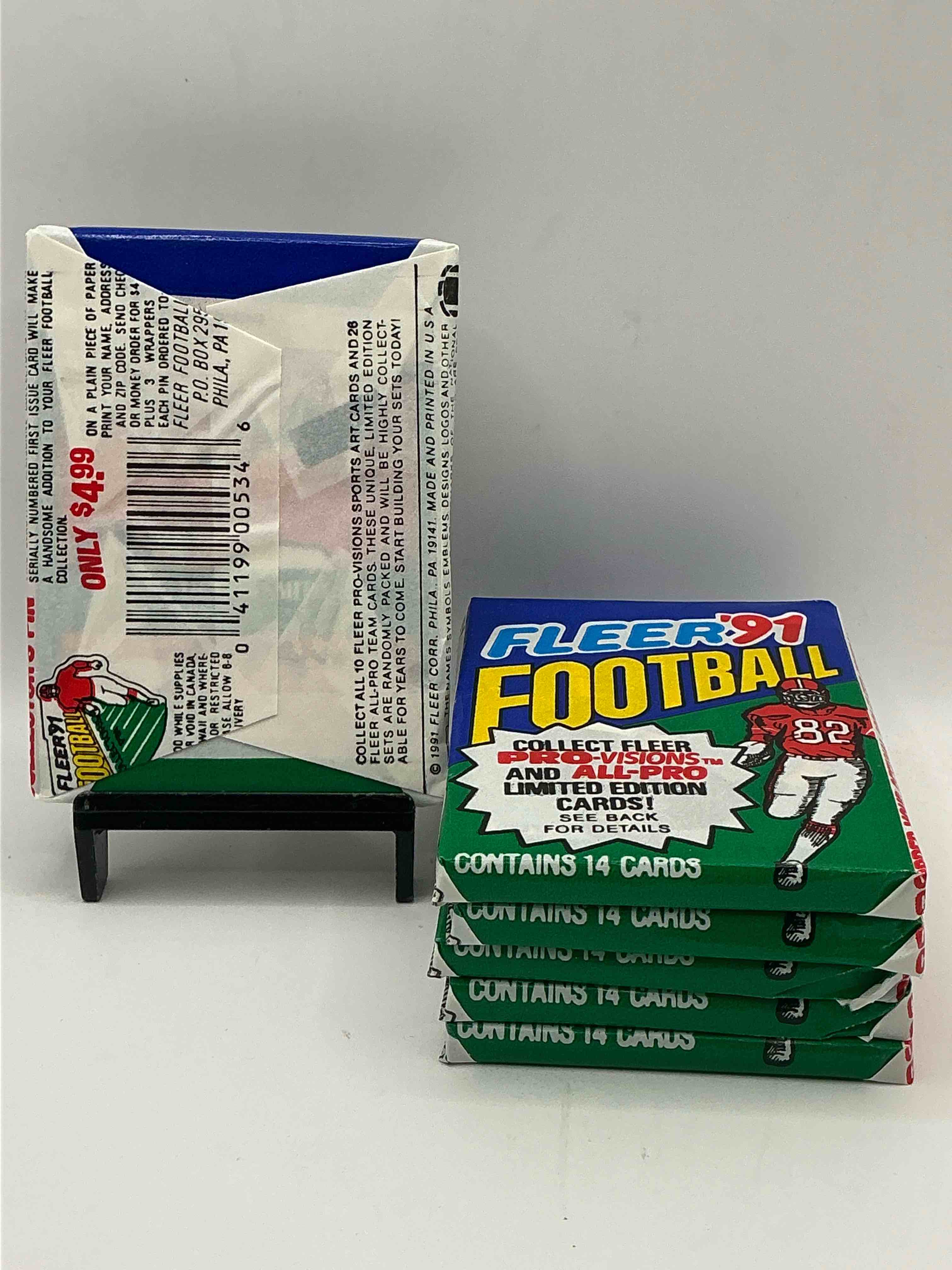 Condition photo showing New/Like New for 1991 fleer football unopened sports card wax pack, direct from original retail case. search for early barry sanders, emmitt smith, jerry rice & joe montana!