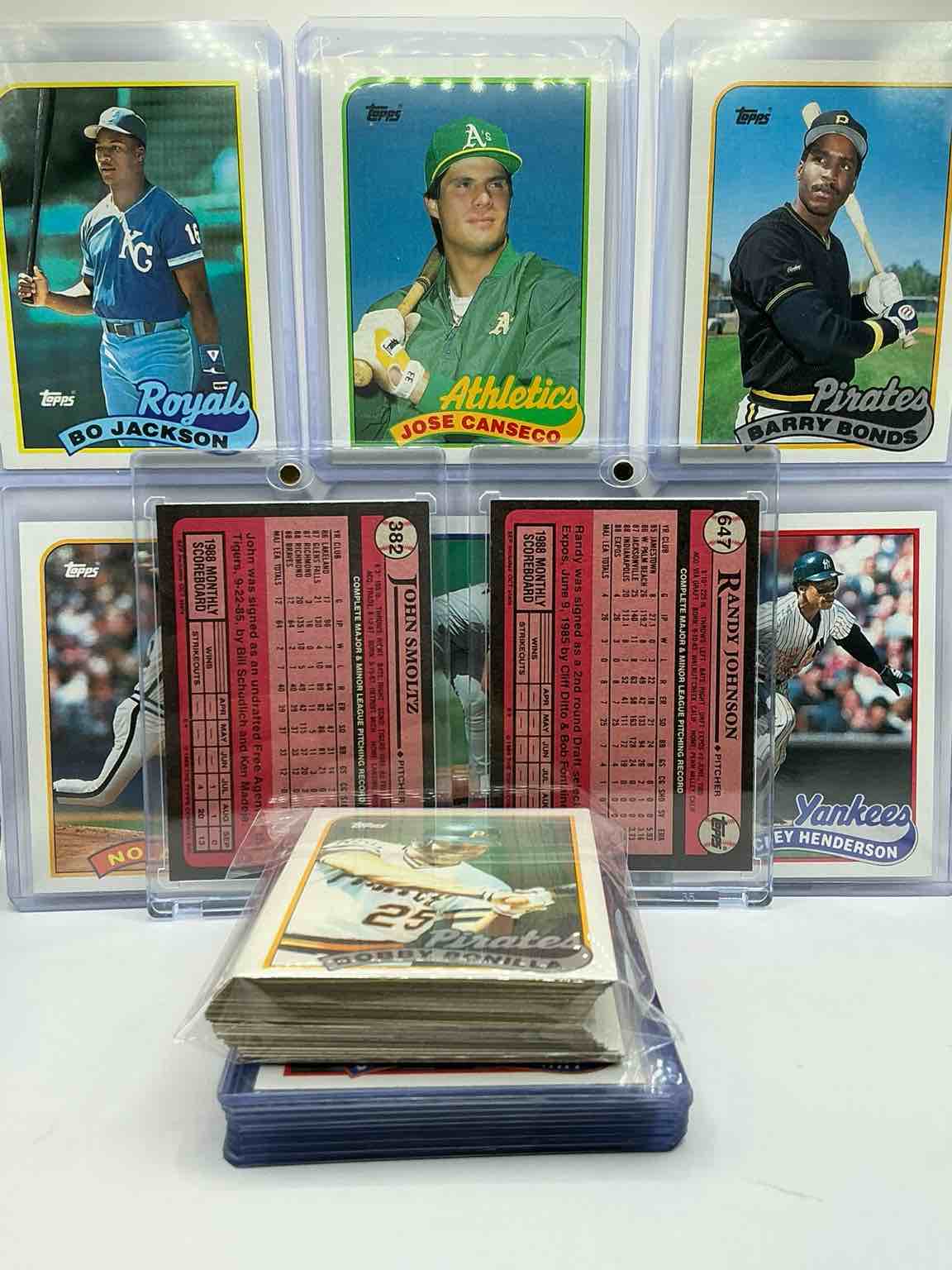 Condition photo showing New/Like New for randy johnson & john smoltz rookies! 1989 topps baseball 50 card craziness! bo jackson, randy johnson, barry bonds, john smoltz, kirby puckett, tom glavine, rickey henderson, don mattingly, cal ripken, wade boggs, doc gooden, greg maddux, fernando valenzuela, nolan ryan, roger clemens, george brett, tony gwynn & more! the best players from the time! super rare set with all of these stars! 50 card craziness! legends, heroes & commons!