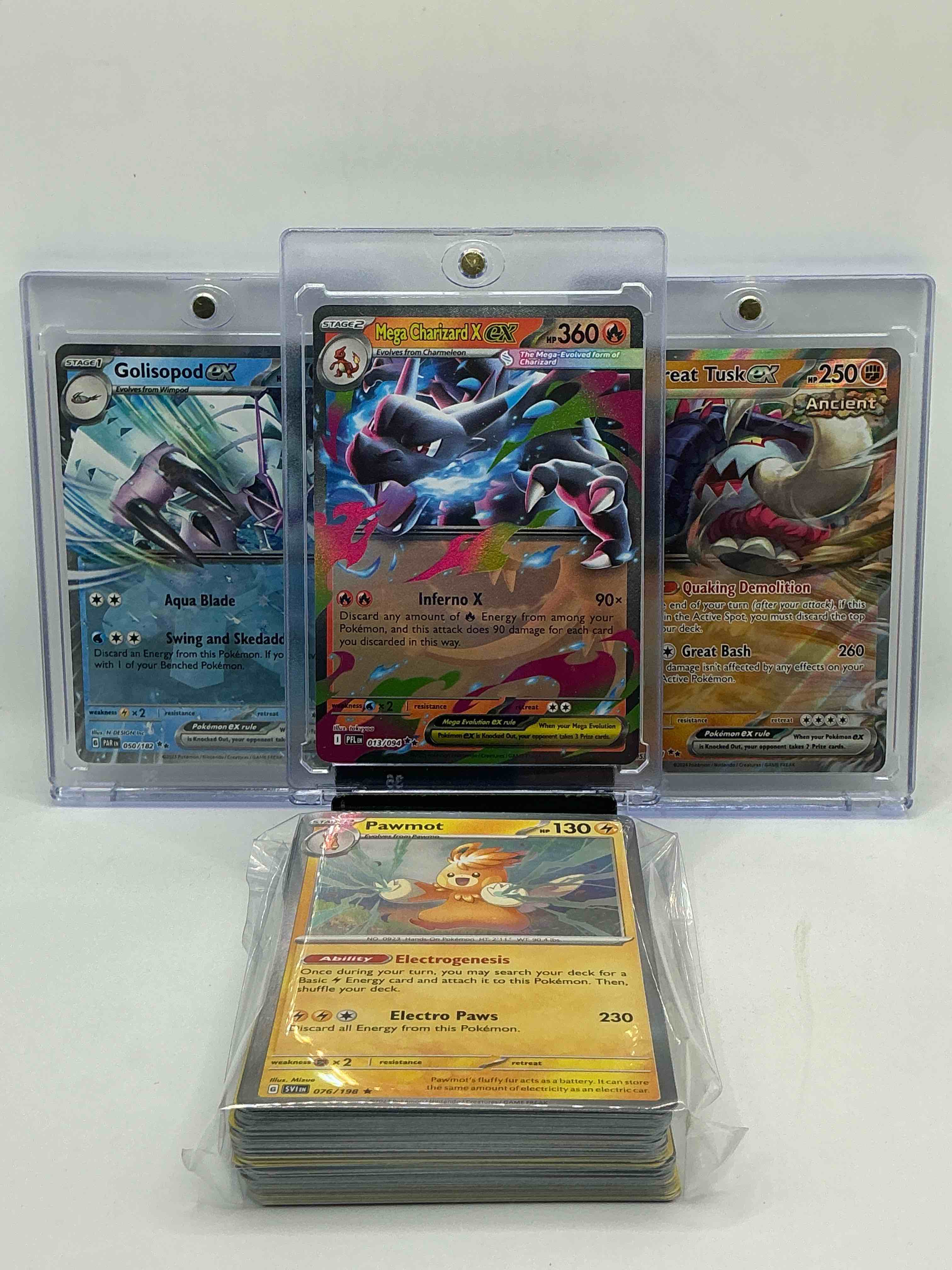 pokémon palooza! mega charizard x ex! golisopod ex! great tusk ex! along with 50 other pokémon heroes, holos, legends & commons- including 1 stage two rare holographic, 2 stage one rare holographic, 3 basic rare holographic, 4 common/ uncommon holographics (all stages), 2 stage two non holographic & 2 rares! also includes 36 non holo common/ uncommon basic & first stage cards trainers & energy too! perfect set for collectors & enthusiasts!