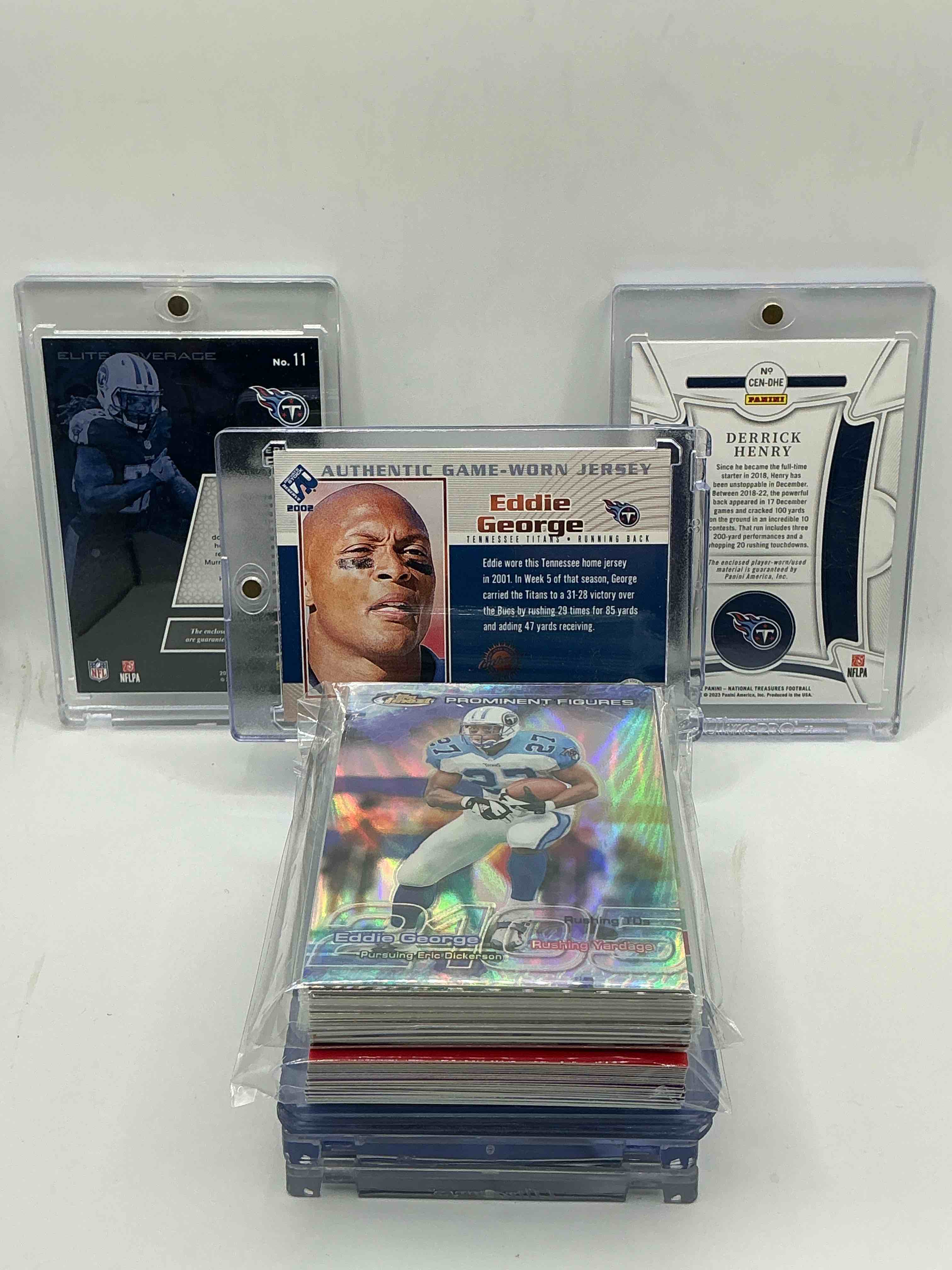 Condition photo showing New/Like New for tennessee titans surprise! 2002 pacific private stock game-worn jersey patch eddie george! 2022 national treasures football century materials patch derrick henry numbered 87/99! 2017 donruss elite “elite coverage” dual patch derrick henry! along with 50 other titans heroes, legends, rookies & commons!