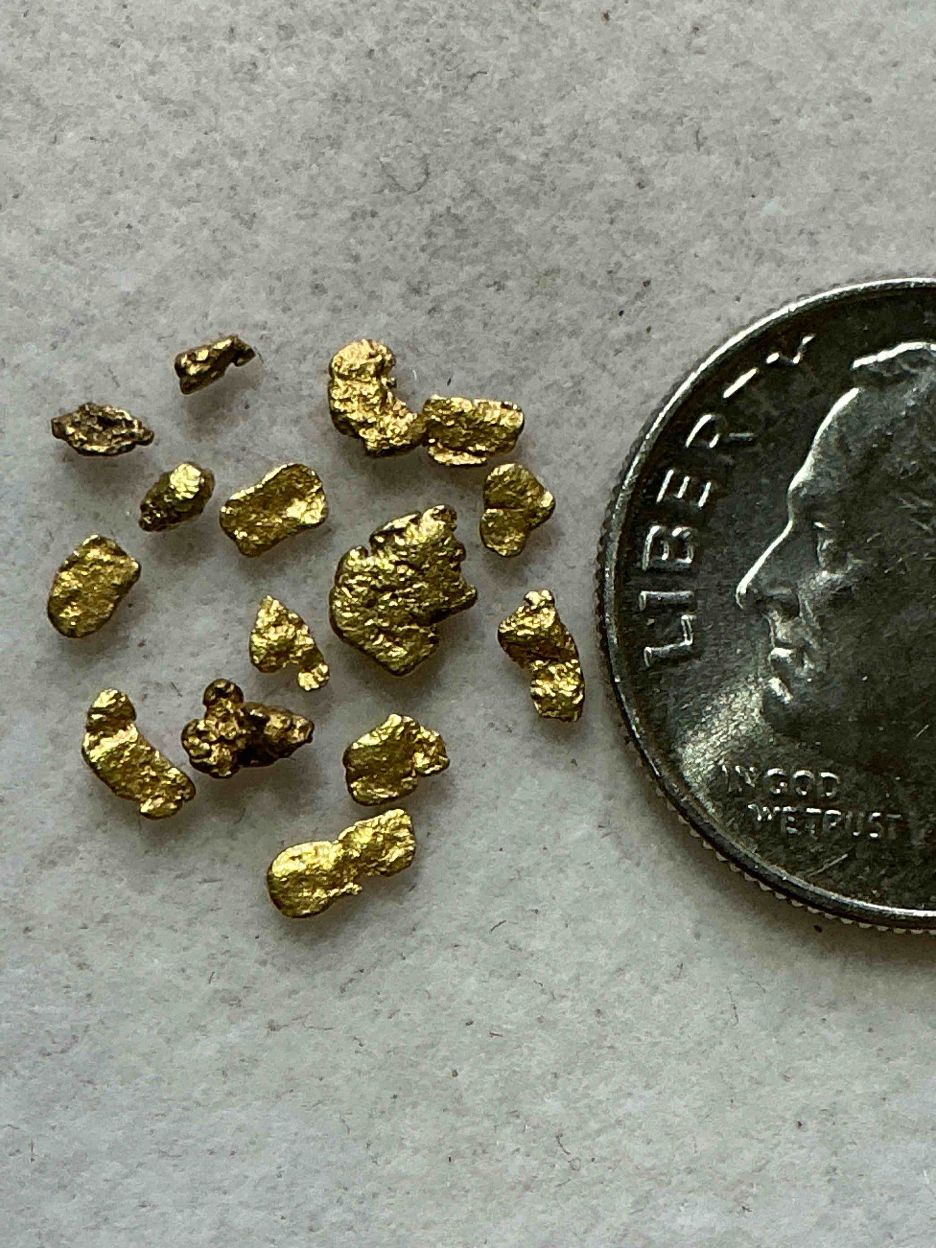 Condition photo showing New/Like New for genuine gold nuggets! gold nuggets fresh from prospecting north carolina mountains, total weight of all nuggets is approximately .5 grams. these gold nuggets typically test at between approx 22-24 karat. gold in raw, prospected form is extremely hard to find & much rarer than any refined form. get in on the gold craze... gold has increased in value over 40% since 2025! u.s. dime for size reference only (not included). gold vile in image included. own genuine, gold nuggets! 