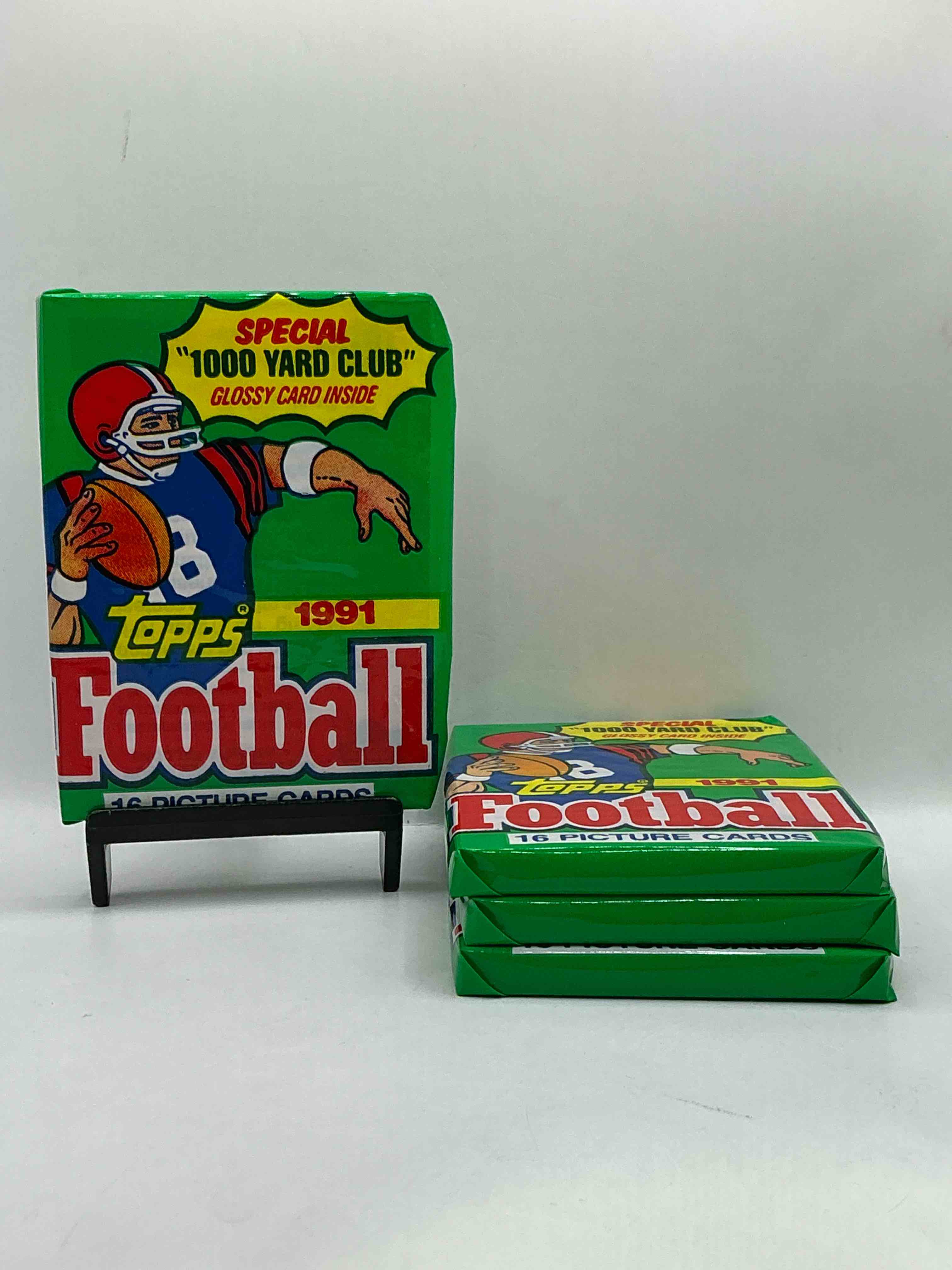 1991 topps football unopened sports card wax pack, direct from original retail case. search for early barry sanders, emmitt smith, jerry rice & joe montana!