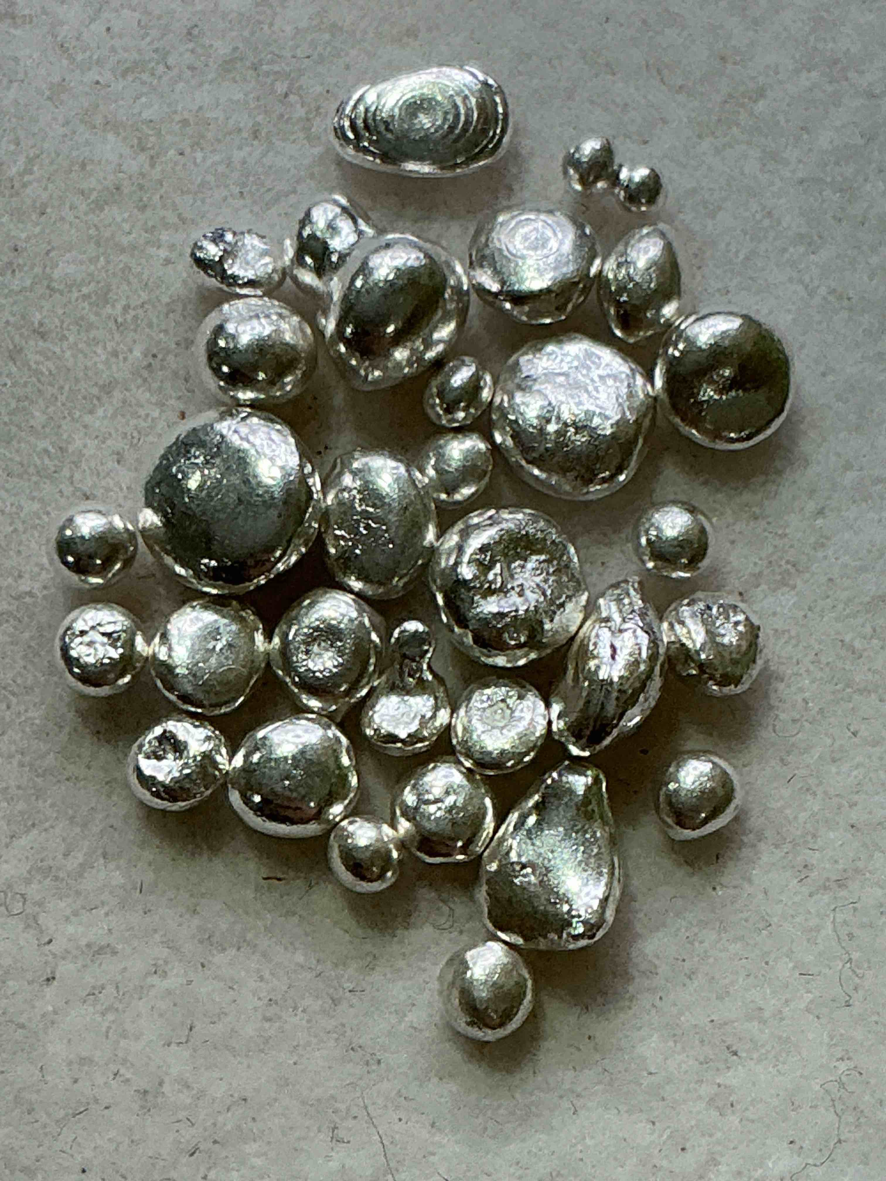 silver nuggets! .999 us fine silver, in small nugget form! total weight of all nuggets in lot approximately 6 grams, bid is per nugget! a cool way to invest in fine us silver! includes collector capsule!